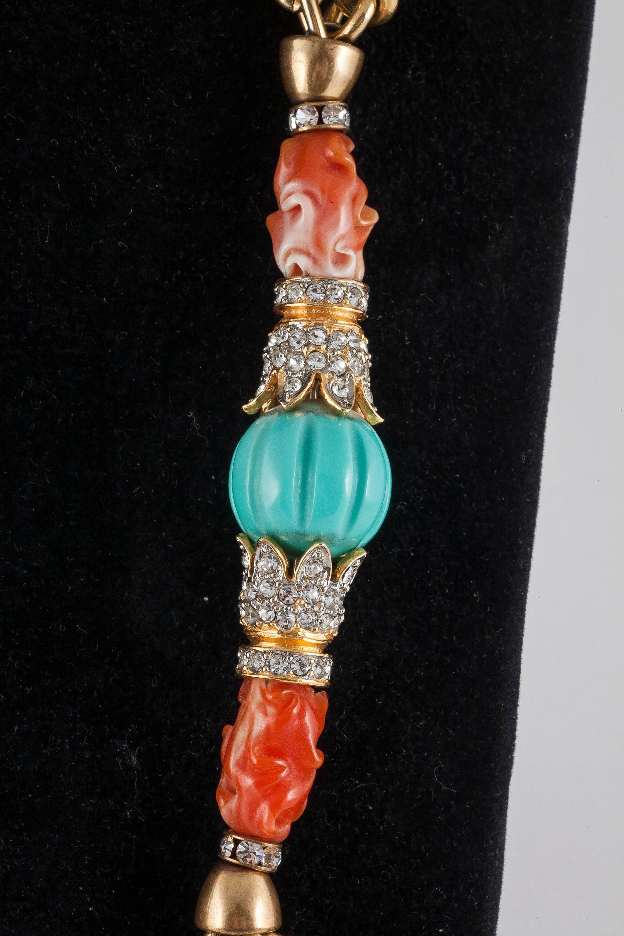 The colours in this delightfully wrought sautoir from Kenneth Jay Lane are perfect for summer featuring the perennial favorites coral and turquoise,these elements made from Lucite  helps  to keep the weight of this show stopper to a wearable summer