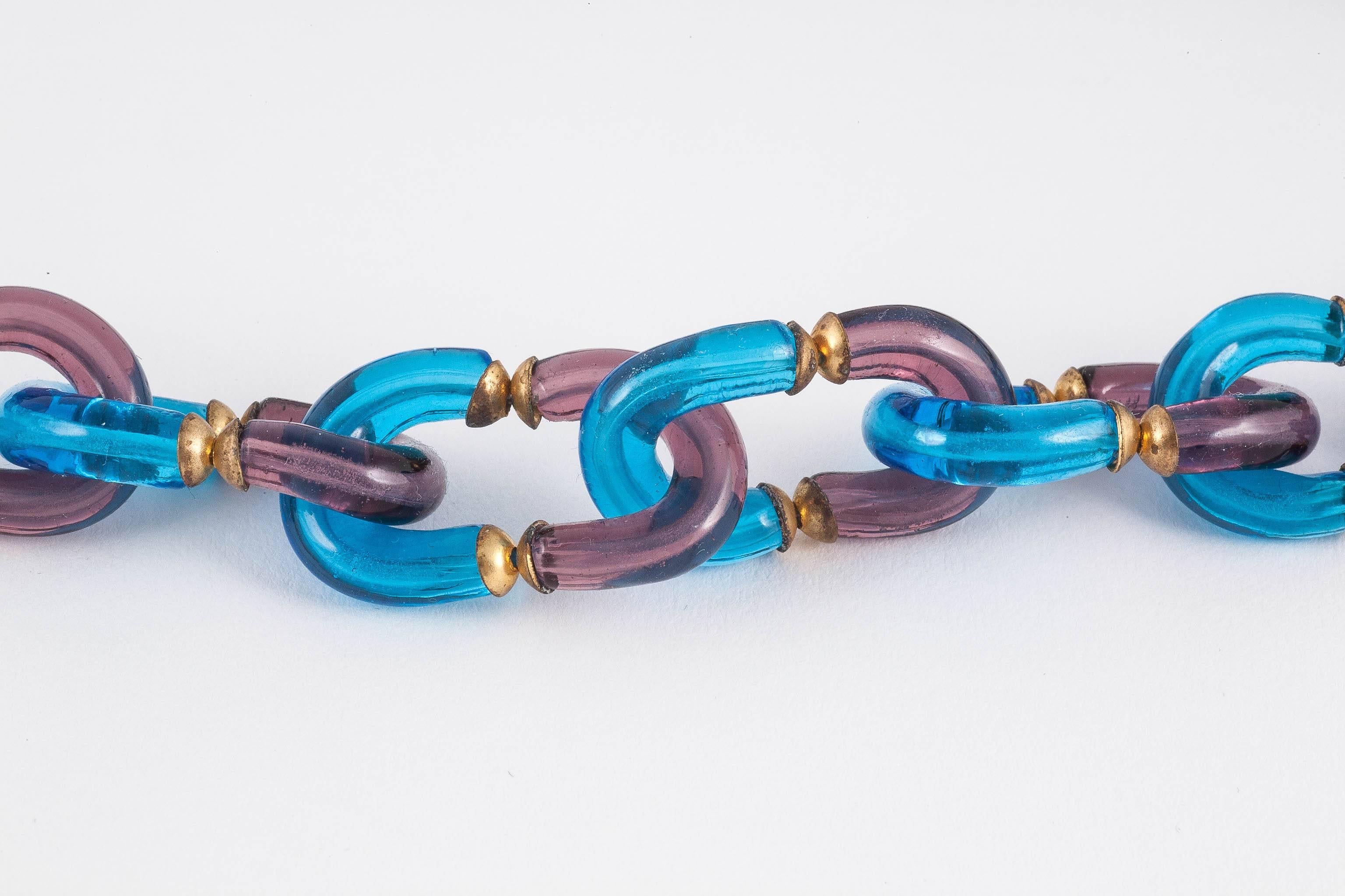 This is a brilliantly coloured example of glass and brass linked chain of the model made for Chanel by Seguso. However, this one is not signed, so we do not know for whom this piece was made. Never the less, it is a beautiful example, the unusual