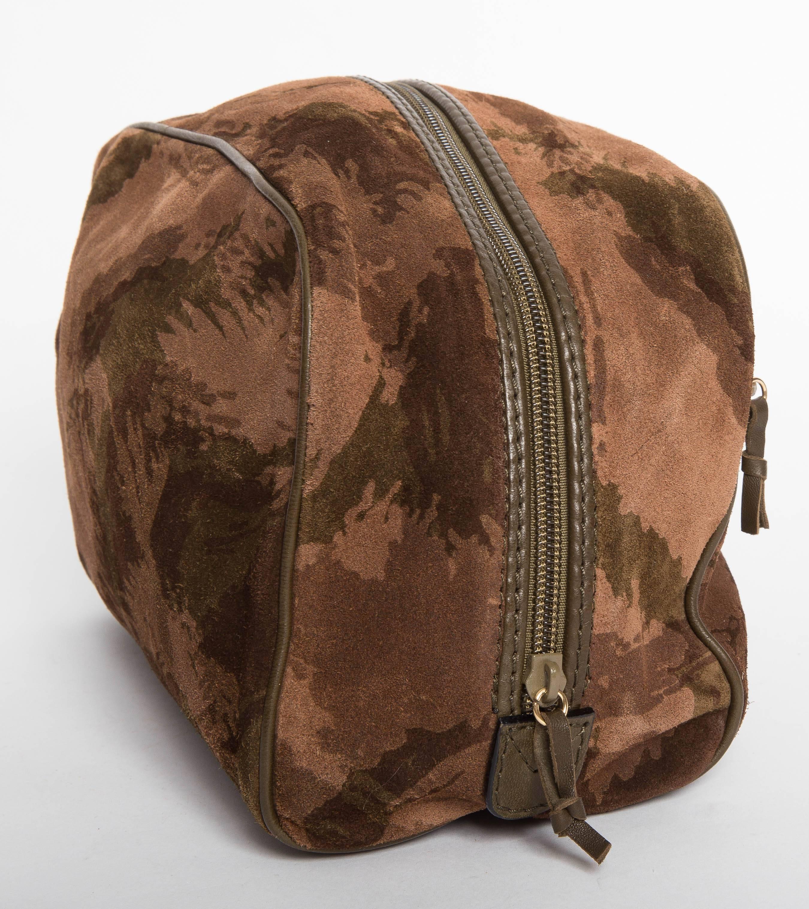 Super Bottega Veneta Camouflage Print Suede Dopp Kit. Interiof is lined in leather and the bag also has a leather bottom. Leather tabs to zip on exterior of the kit as well as the zip pull on the top of the dopp kit. The interior is in very good
