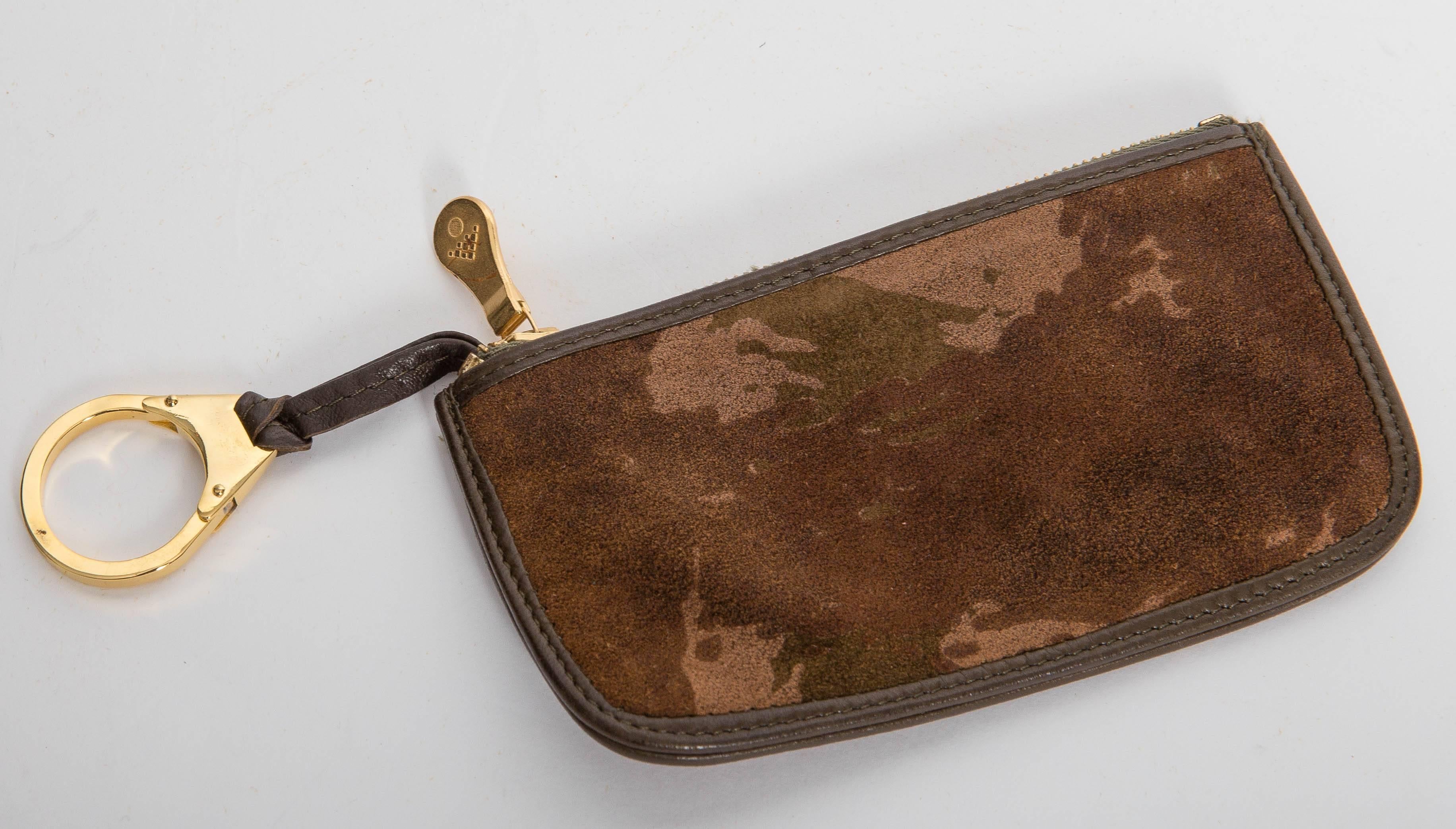 Fantastic Bottega Veneta Camouflage Suede Key Ring / Credit Card Holder. Concition is excellent. Features a leather toggle with brass key ring on the inside of the case. Lined in leather with leather trim and brass pull. 
This piece is part of a