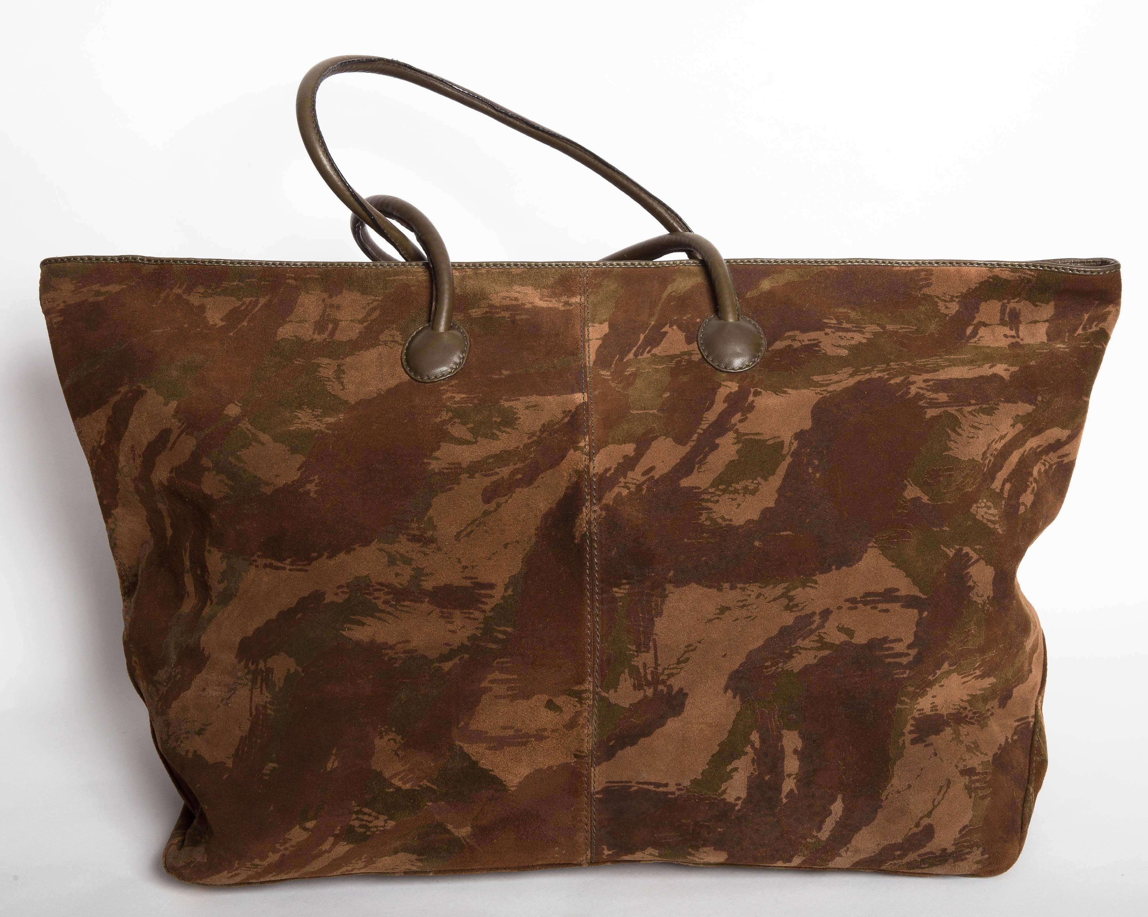 Stunning Bottega Veneta Camouflage Suede Duffle Bag with Double Leather Handles and five brass feet. Includes Leather ID case with toggle. This gorgeous duffle bag has a long zip closure and is lined in leather. Interior and exterior are in