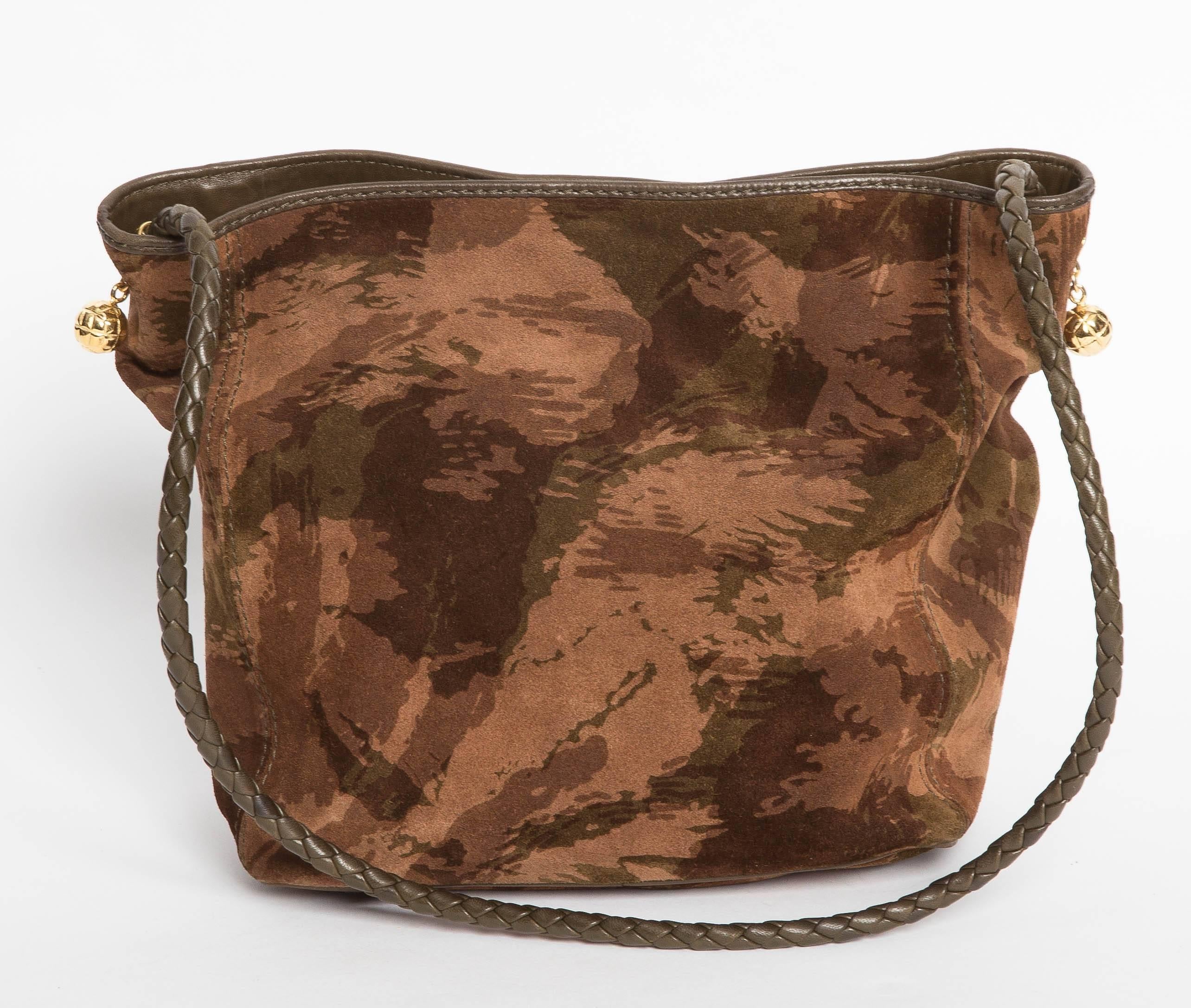 Bottega Veneta Camouflage Suede Tote with Braided Leather Handle and Gold Hardware. This tote is lined in polished cotton and features one inner zip pocket. The handle loops through gold circular openings and features 2 gold ball shaped toggle