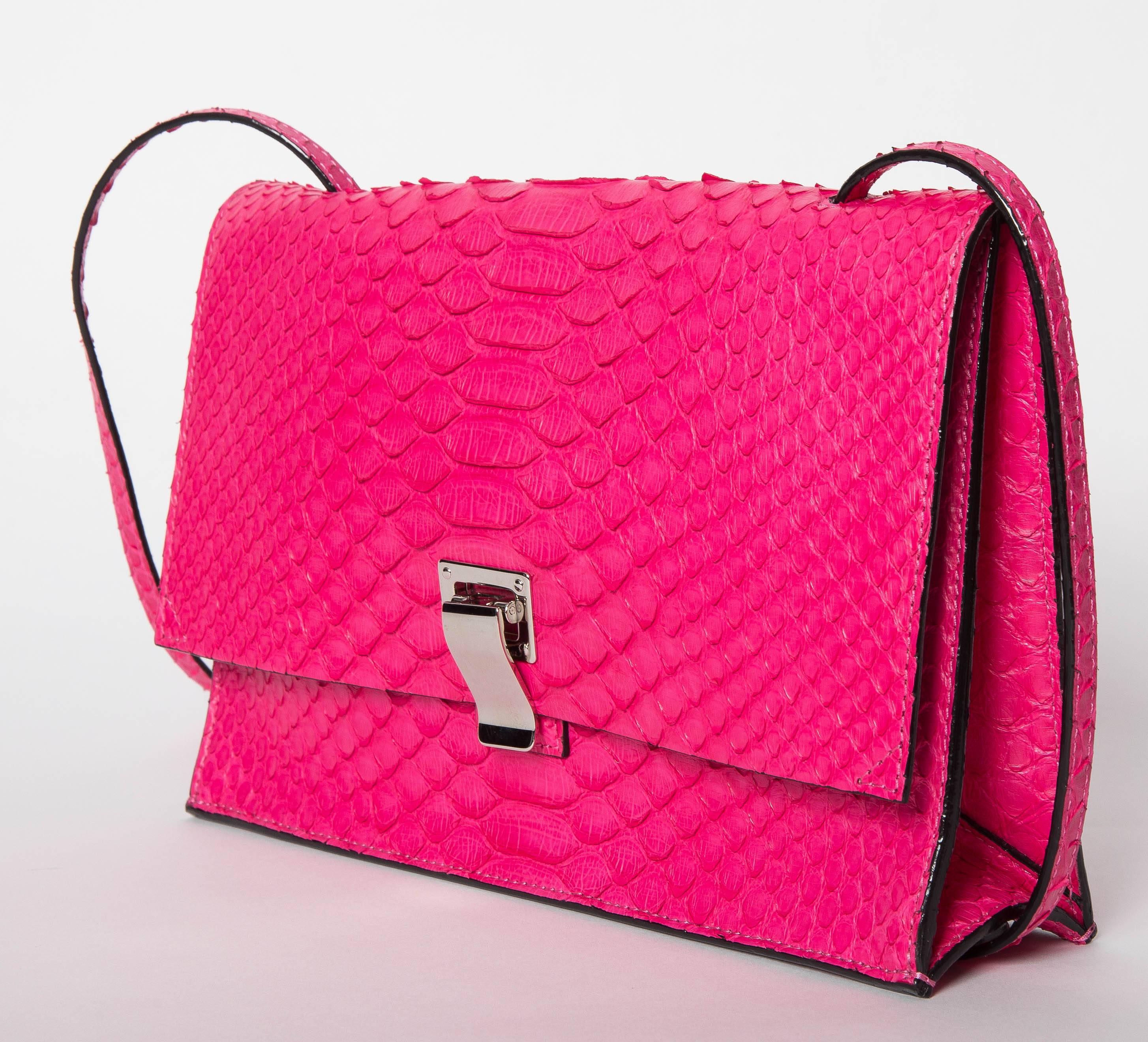 Proenza Schouler Hot Pink Python Shoulder Bag with Palladium Hardware.
Shoulder Strap is Adjustable and long enough for the bag to be worn as a crossbody. The bag is lined in a metallic grey leather and has one outside pocket. 
As we do not hold the