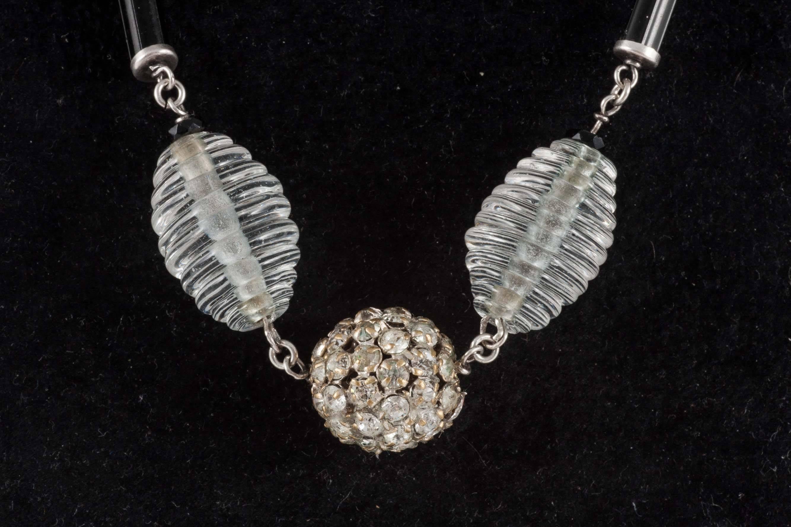 A beautiful survival from the 1920s, this lovely piece has crackle and spun glass clear beads, interspersed with rhinestone encrusted balls and beautiful black enamel cylinders. High on glamour but low on weight, this could become a favourite for