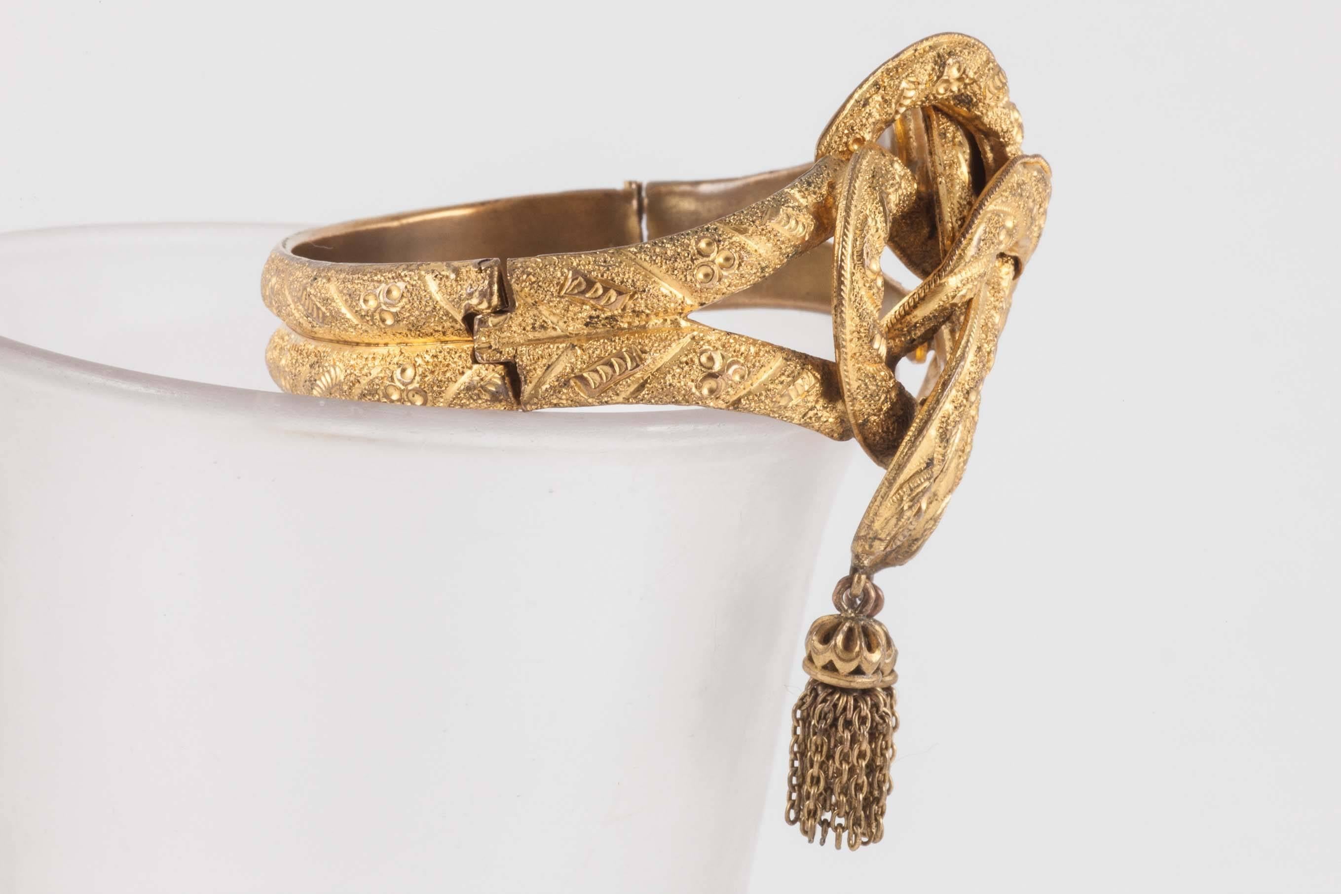 Bracelets of this form were very fashionable in the early years of Queen Victoria's reign. She wore a knotted snake bracelet to her first council meeting at Kensington Palace in 1837. No doubt this lovely survival was a copy of a gold version. It is