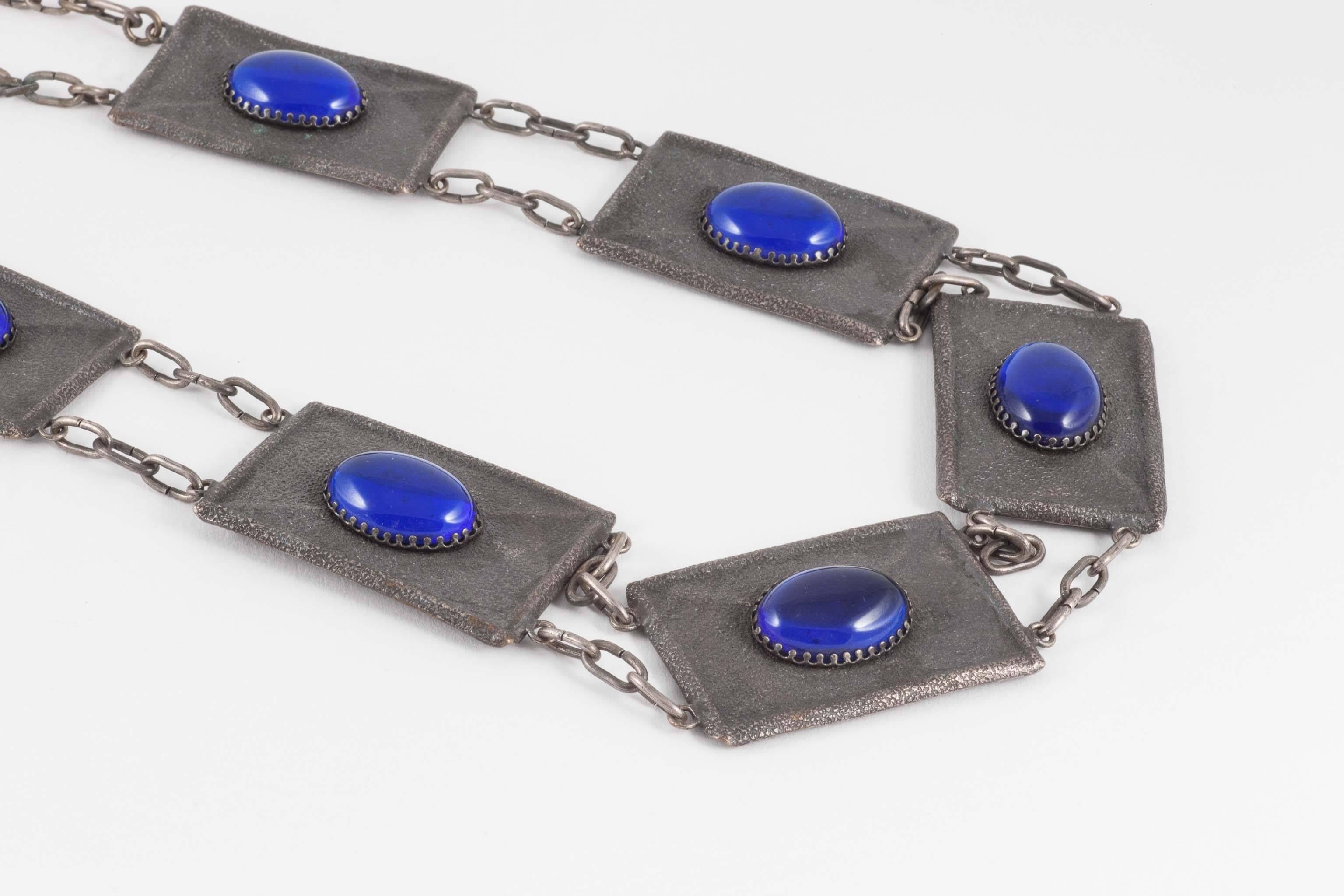 I absolutely love the bold statement this pendant makes. It is so Game of Thrones! The Celtic style engraving along with intense and large cobalt blue glass cabochons suggest that this monumental set may have been made for a theatrical production or