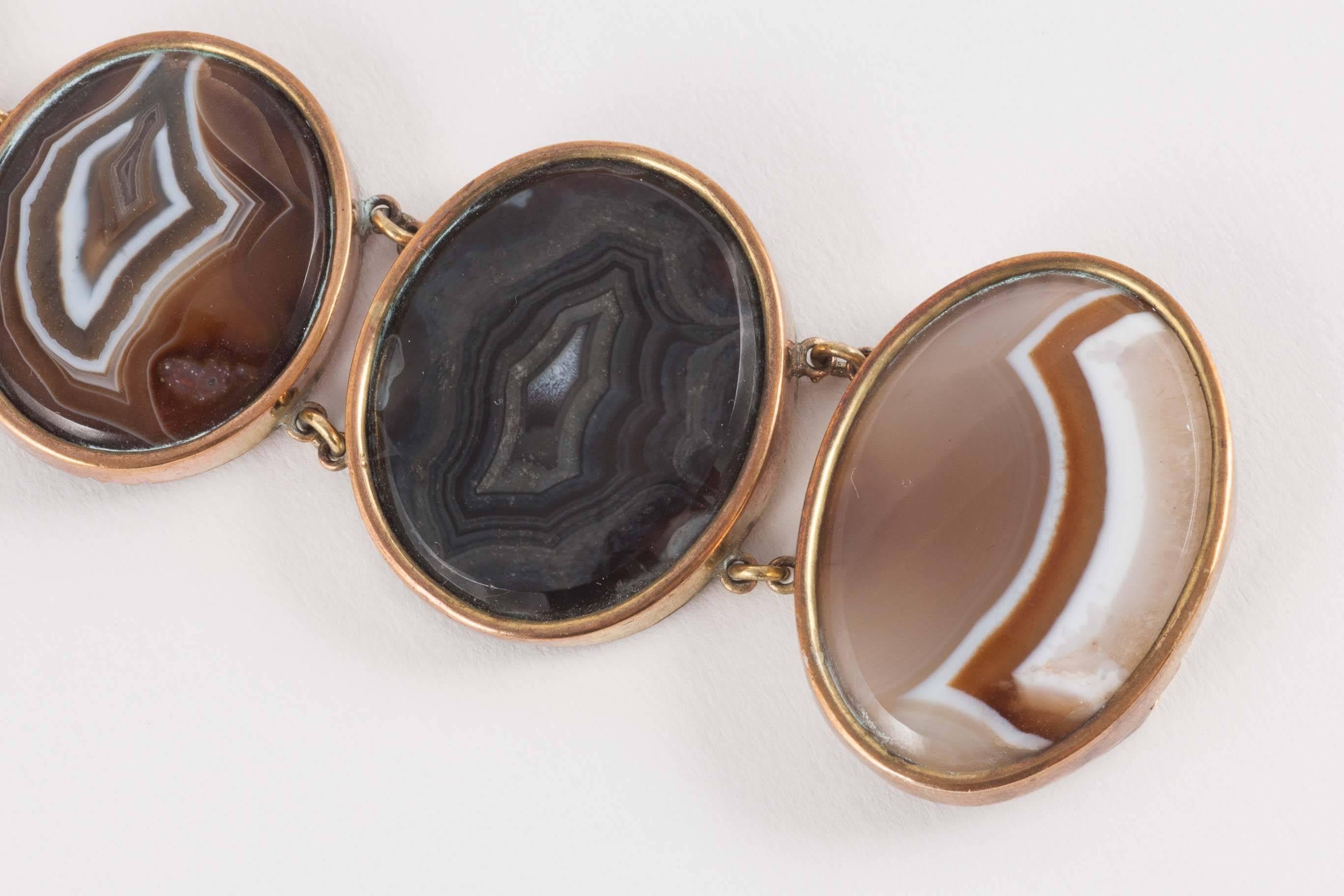 This 19th Century bracelet has truly amazing colour and pattern. Nicely set into gilt brass, the simple design allows the colour and striking natural patterns of the agates their full glory. Each stone has a beautifully hand cut bevel to the edges