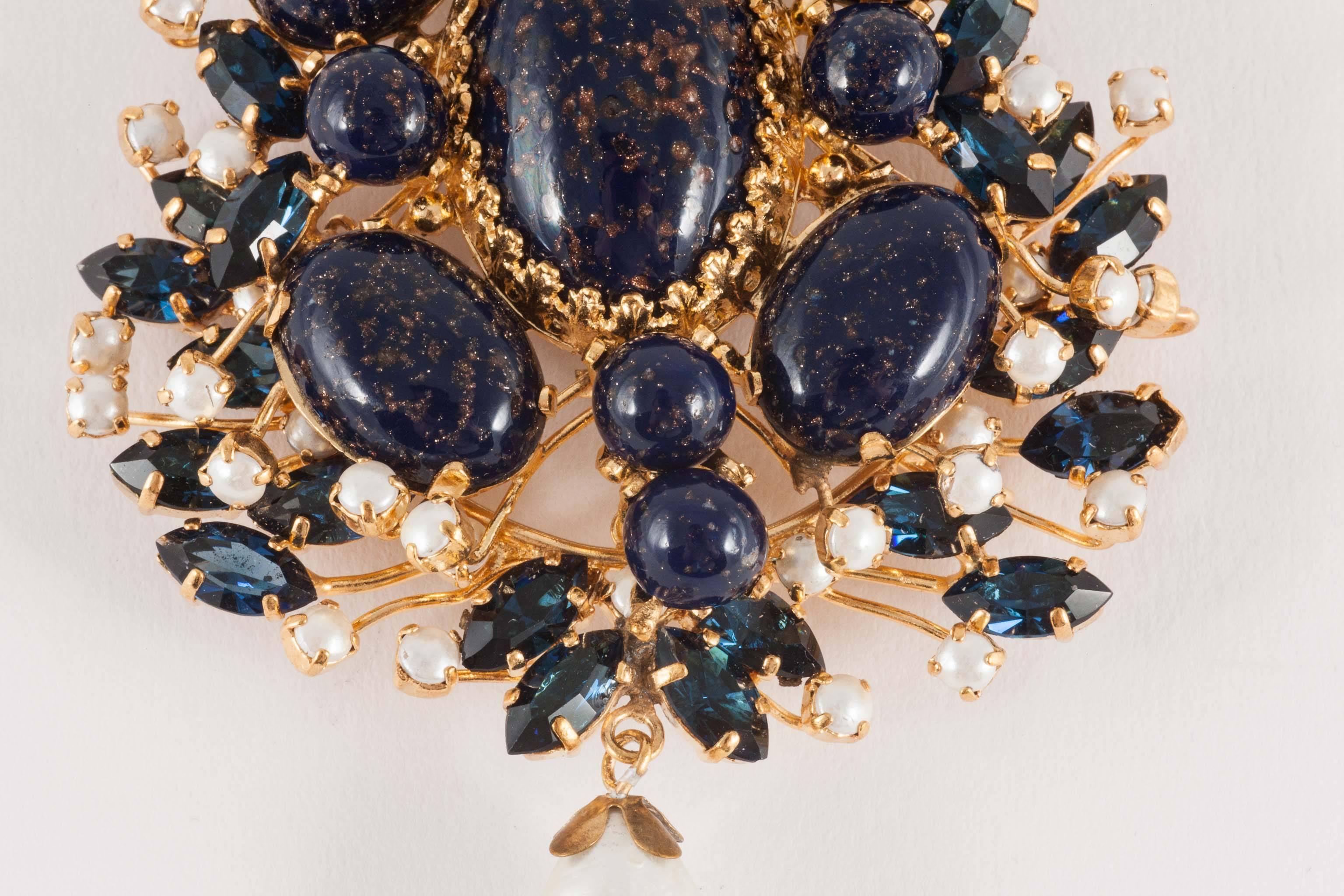 An exquisite handmade poured glass, paste and pearl brooch by Maison Gripoix, from the 1960s. Although not attributed to any design house, this could be a piece made for Christian Dior or one of the other couture houses. the poured glass imitates