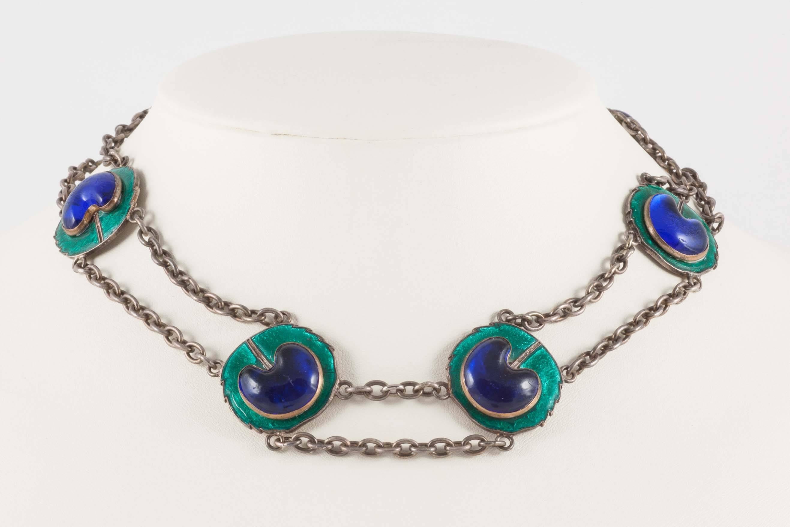 This is a lovely set of Art Nouveau jewellery. The peacock eye is enamel and glass on low grade engraved silver. The necklace also features low grade silver chain and enamelled discs and an original barrel clasp. Piel Freres worked in the latter