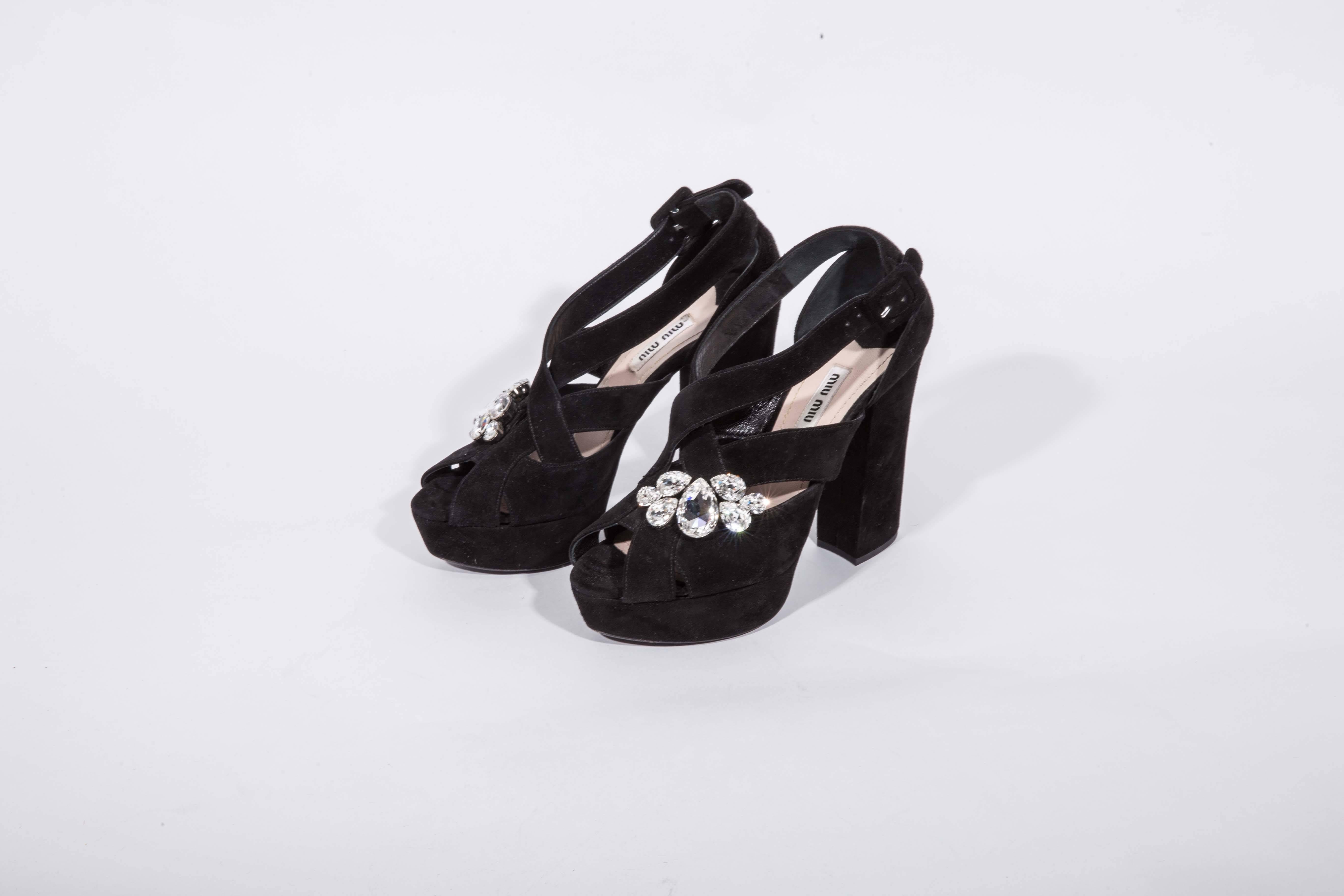 Black Suede Miu Miu Platforms with Crystal Embellishment. These shoes are a size 38 / 8 and have never been worn. AMAZING !!!