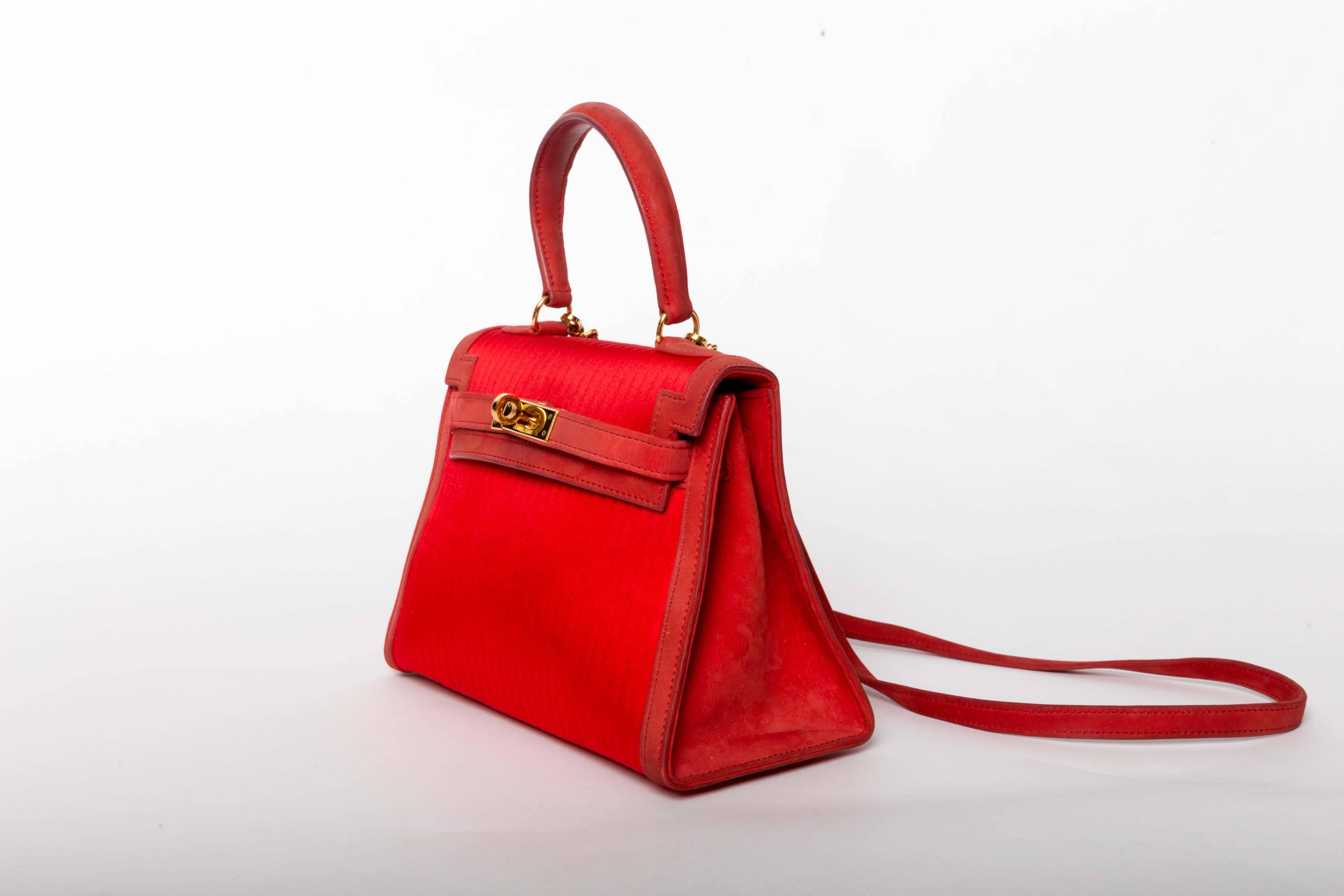 Exceptionally rare vintage Hermes  20cm mini Kelly bag in red satin and suede nubuck with gold hardware and detachable shoulder strap.  Limited edition / very rare bag in good to very good condition. A trip to the spa would rejuvenate this stunning