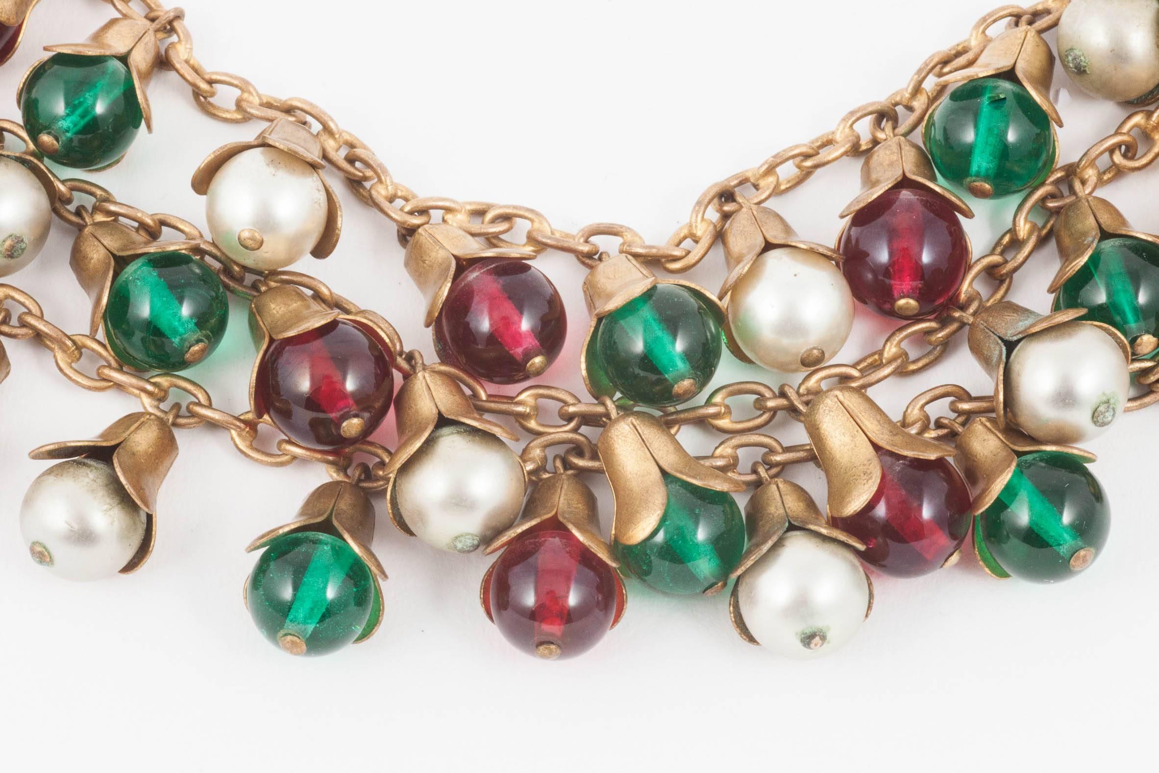 This classic combination of red and green glass with mother of pearl is always a great look and this bracelet is no exception. Unsigned but with a quality, weight and tactile wearability, it would fit into a casual as well as more tailored ensemble.