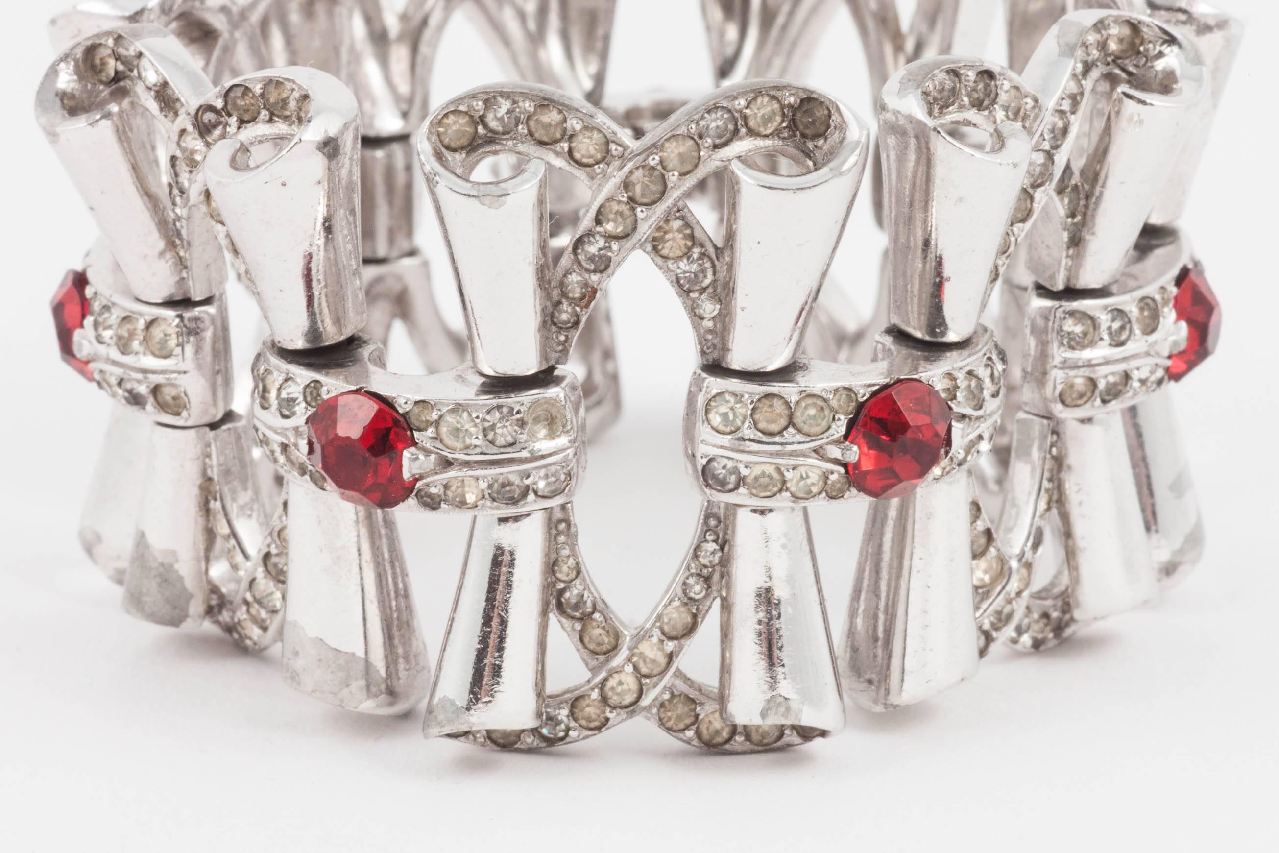 Retro Fluid rhodium plated cocktail bracelet with clear and red paste accents, 1950s