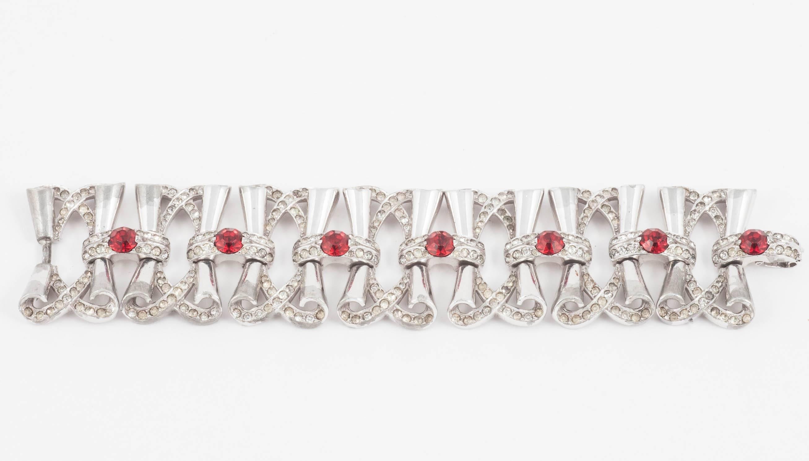 Fluid rhodium plated cocktail bracelet with clear and red paste accents, 1950s In Good Condition In Greyabbey, County Down