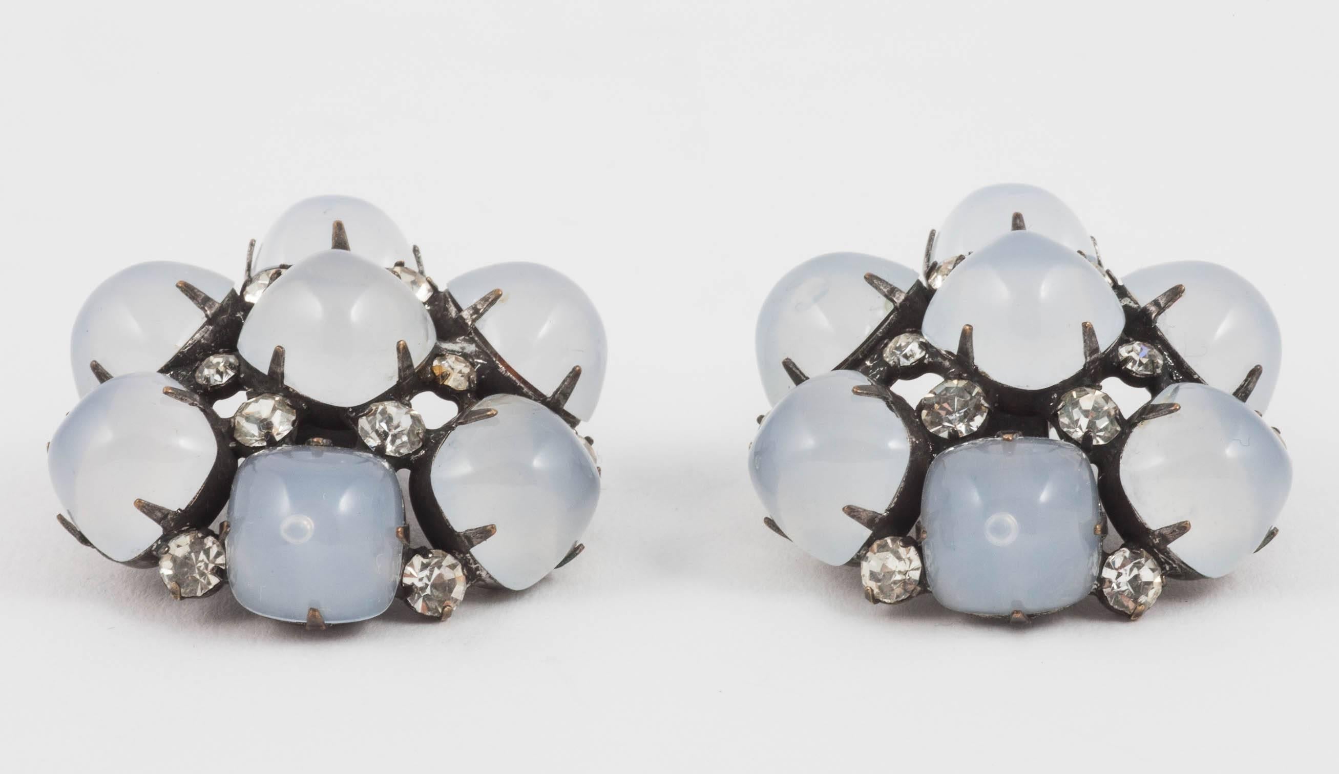 These are from Kenneth Jay Lane's early career when he made pieces for every socialite in New York, Jackie [Kennedy] Onassis and the Duchess of Windsor among them! Large pale grey glass cabochons are hand set onto a gunmetal base and dotted with
