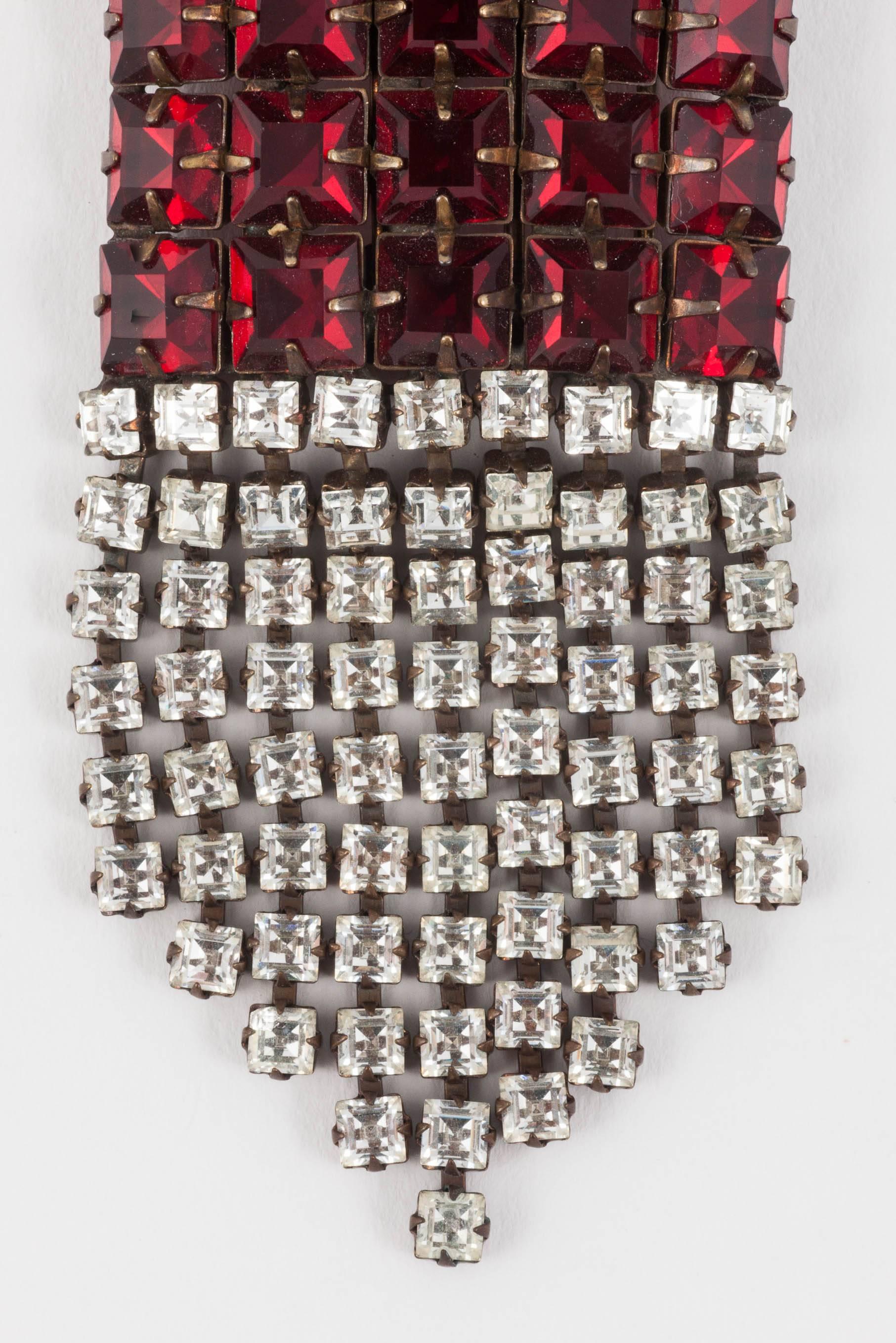 Unusually hand set on a dark copper mount, this wonderful brooch/pendant is very simple and very striking. The ruby coloured square stones are deeply bevelled almost making them like hobnail glass and creating a luscious shimmer. Stunning on a brave