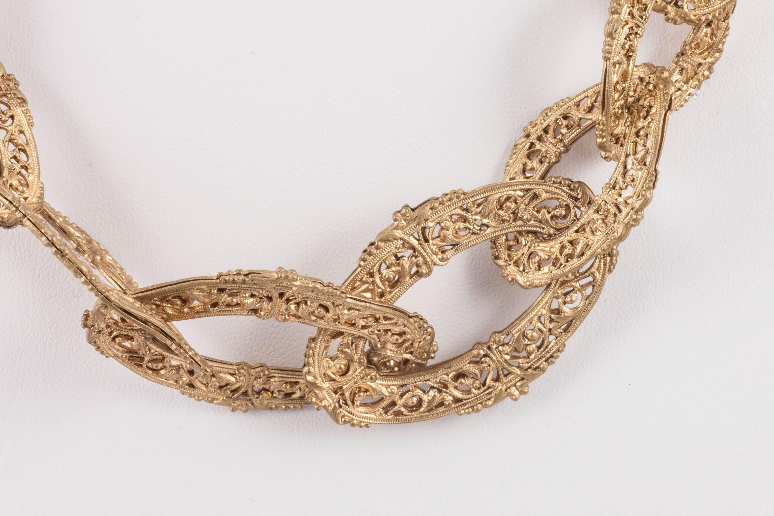 A rare and very decorative 'chain' necklace, very collectable, from Chanel in the early 1960s, made in the Byzantine style, from delicate filigree metal links, that create a graduated necklace. A very iconic style, and simply marked in the old way,