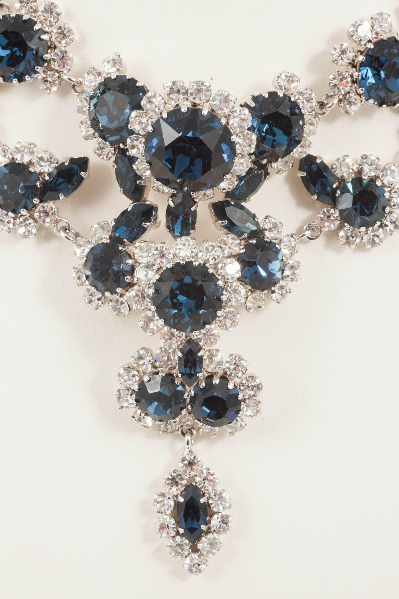 This striking articulated necklace, in sapphire and clear pastes, from the 1960s, is made from the finest Austrian hand set pastes and is a classic example of the pieces being produced in the country at that time. Attributed to Christian Dior, many
