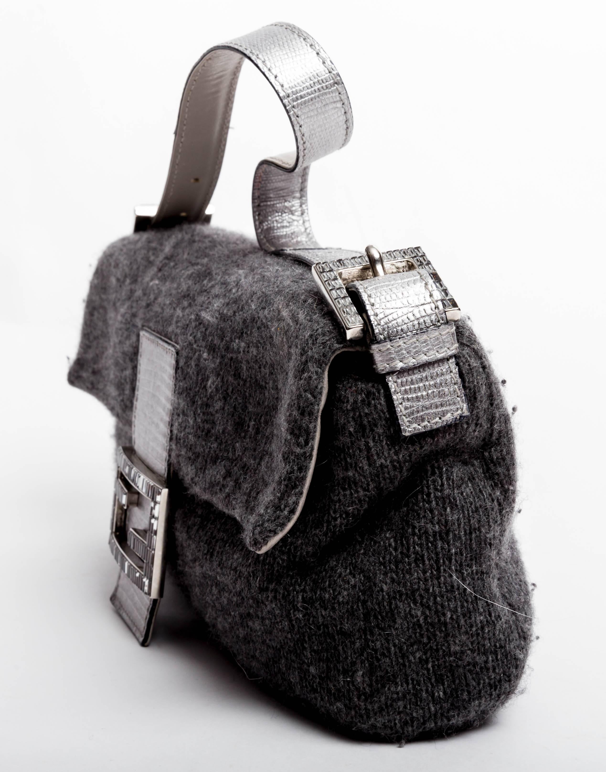 Very chic Fendi Baguette in grey cashmere with silver leather handle and crystal baguette logo. Interior zip pocket. 
Handle drop is 6 inches.
Comes with Fendi dust bag.
