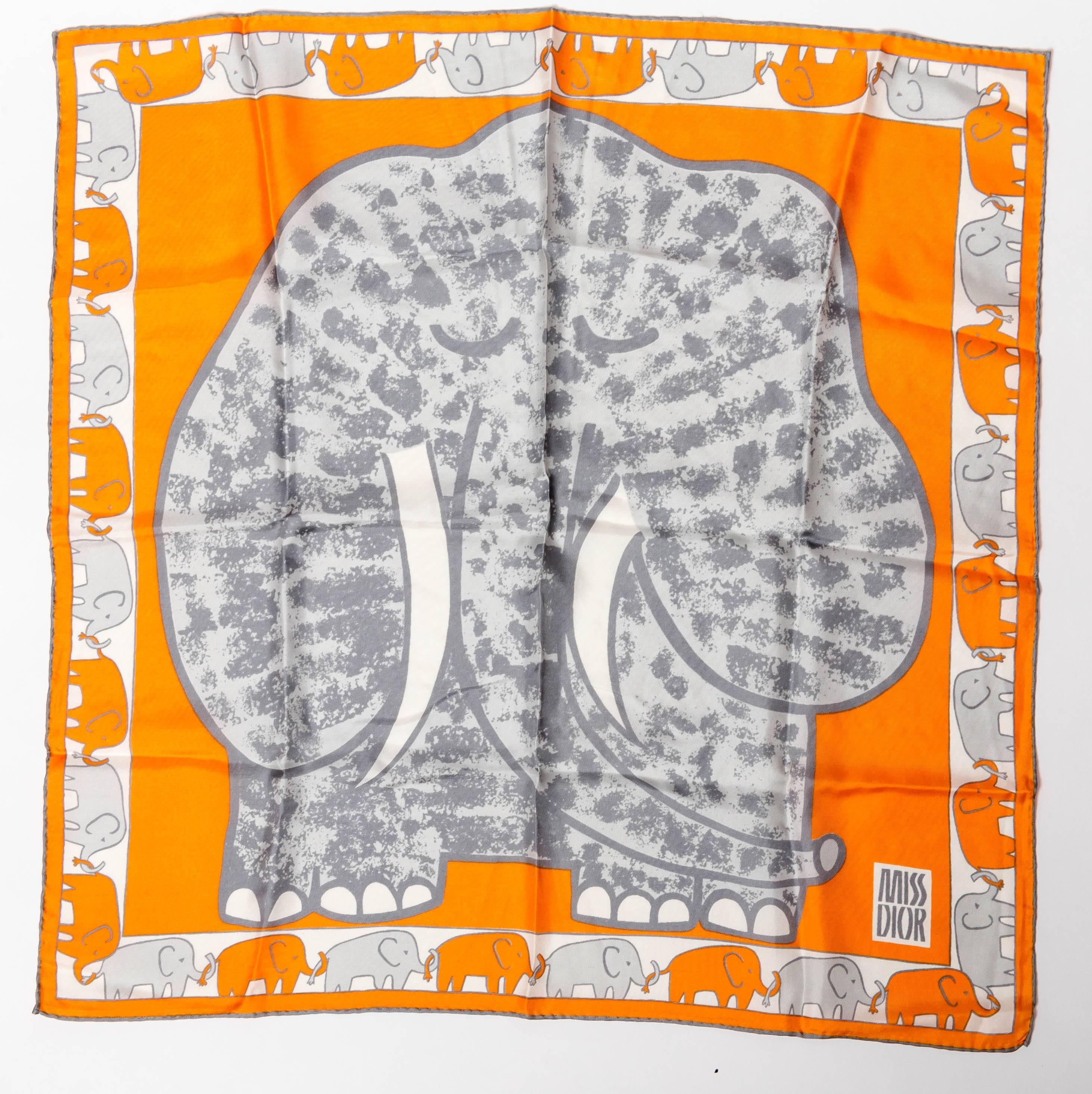 For all elephant lovers everywhere, this Miss Dior adorable silk scarf with rolled hem is your perfect accessory. Features a large elephant to the center of the scarf and a border of intertwined elephants. In orange and gray, this scarf measures