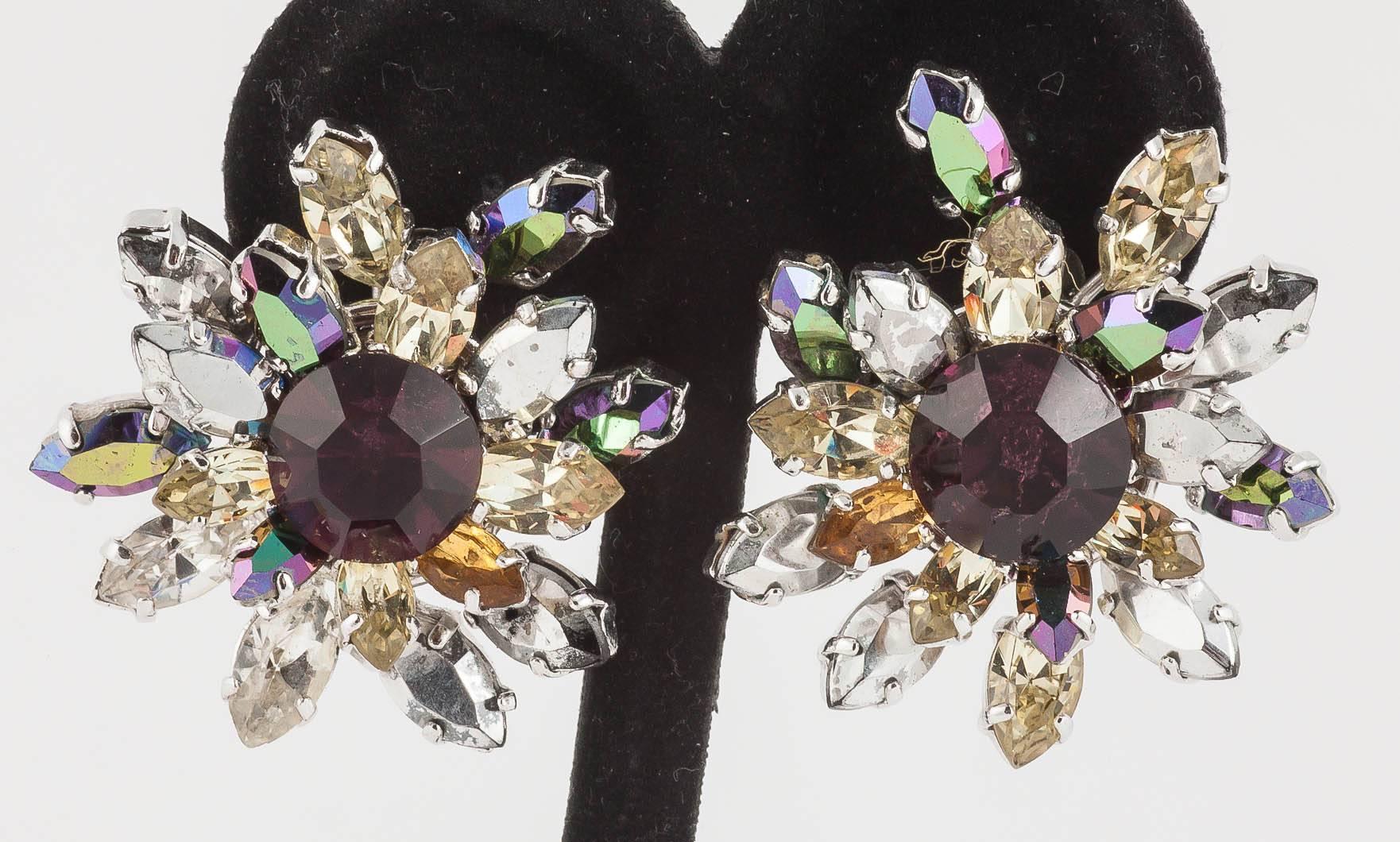 Beautifully chosen colours make these 1959 earrings by Henkel and Grosse for Christian Dior, special and striking. A large amethyst paste central stone is surrounded by silver, citrine, topaz and amethyst aurora borealis navette cut stones