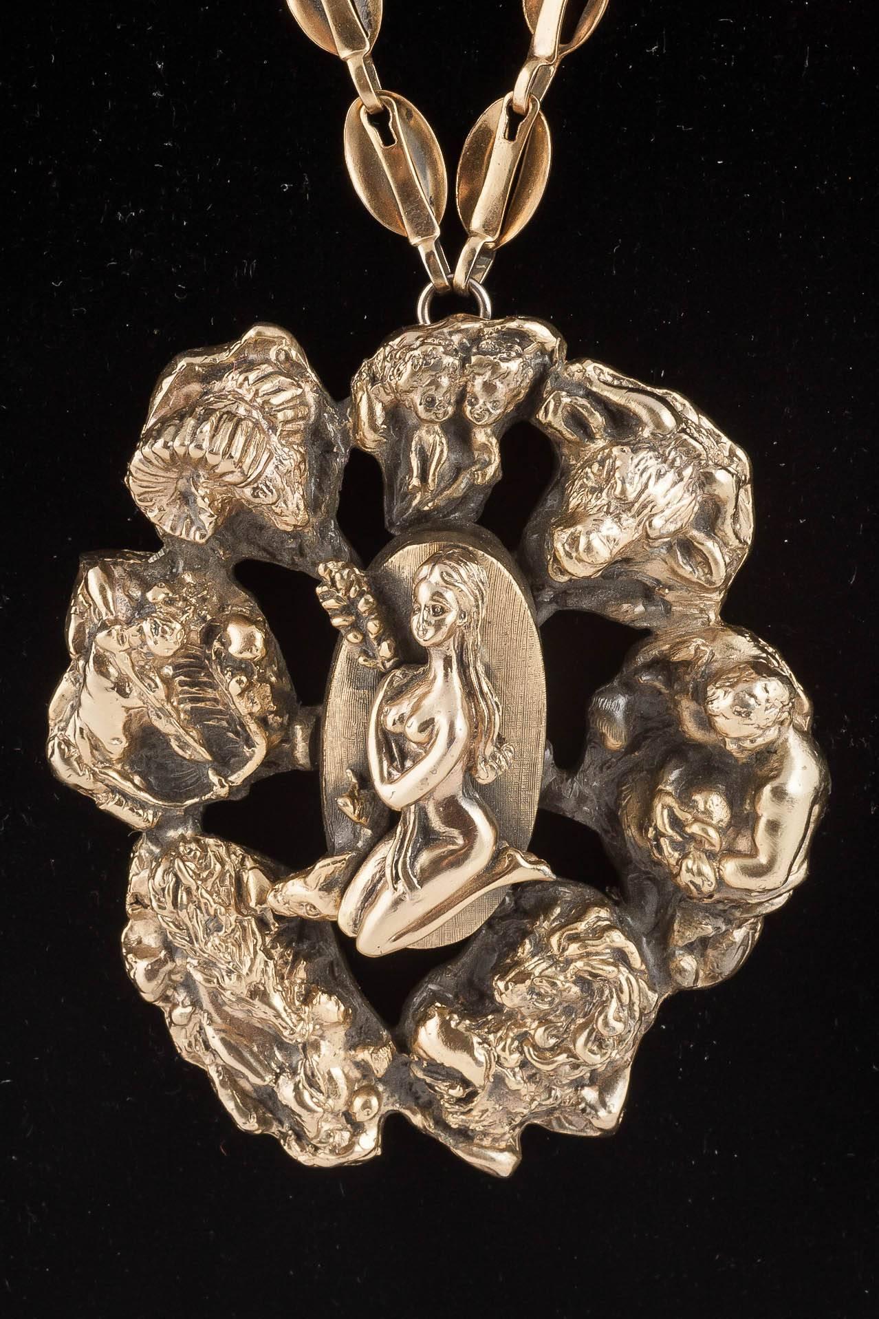 This is such a quirky piece. The zodiac series by Tortolani is one of his most famous lines. This piece encompasses most of the zodiac imagery into one fabulous pendant. Cast in solid pewter then gilded in a muted gilt with blackened shading, it is
