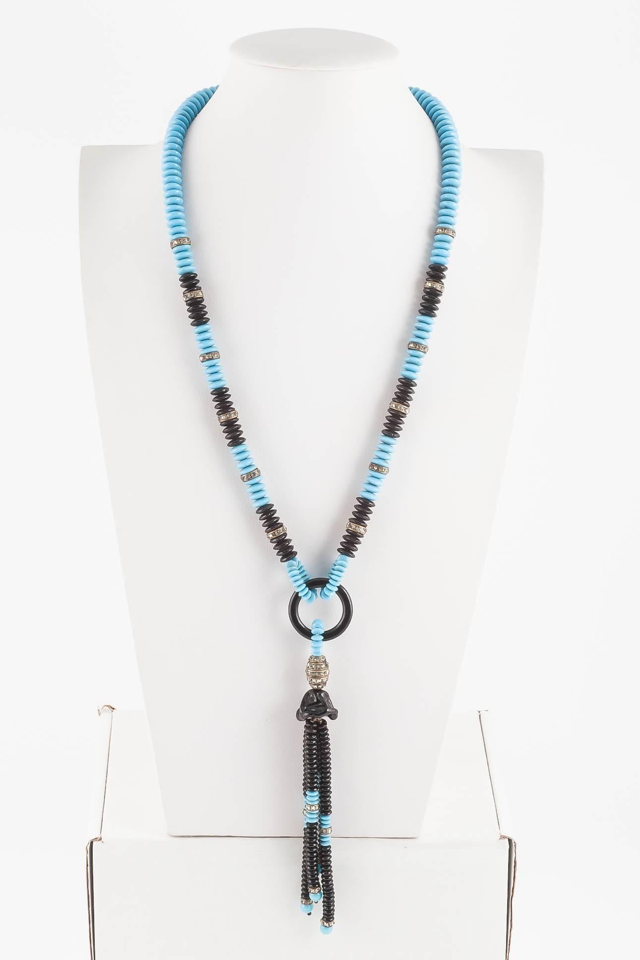 Lovely turquoise and black glass 'donut' bead sautoir necklace, with a tassle, dropping from a faceted back glass ring and moulded black glass 'bell', highly typical and stylish of this period. A paste oval 'ball' and interspersed paste rondelles