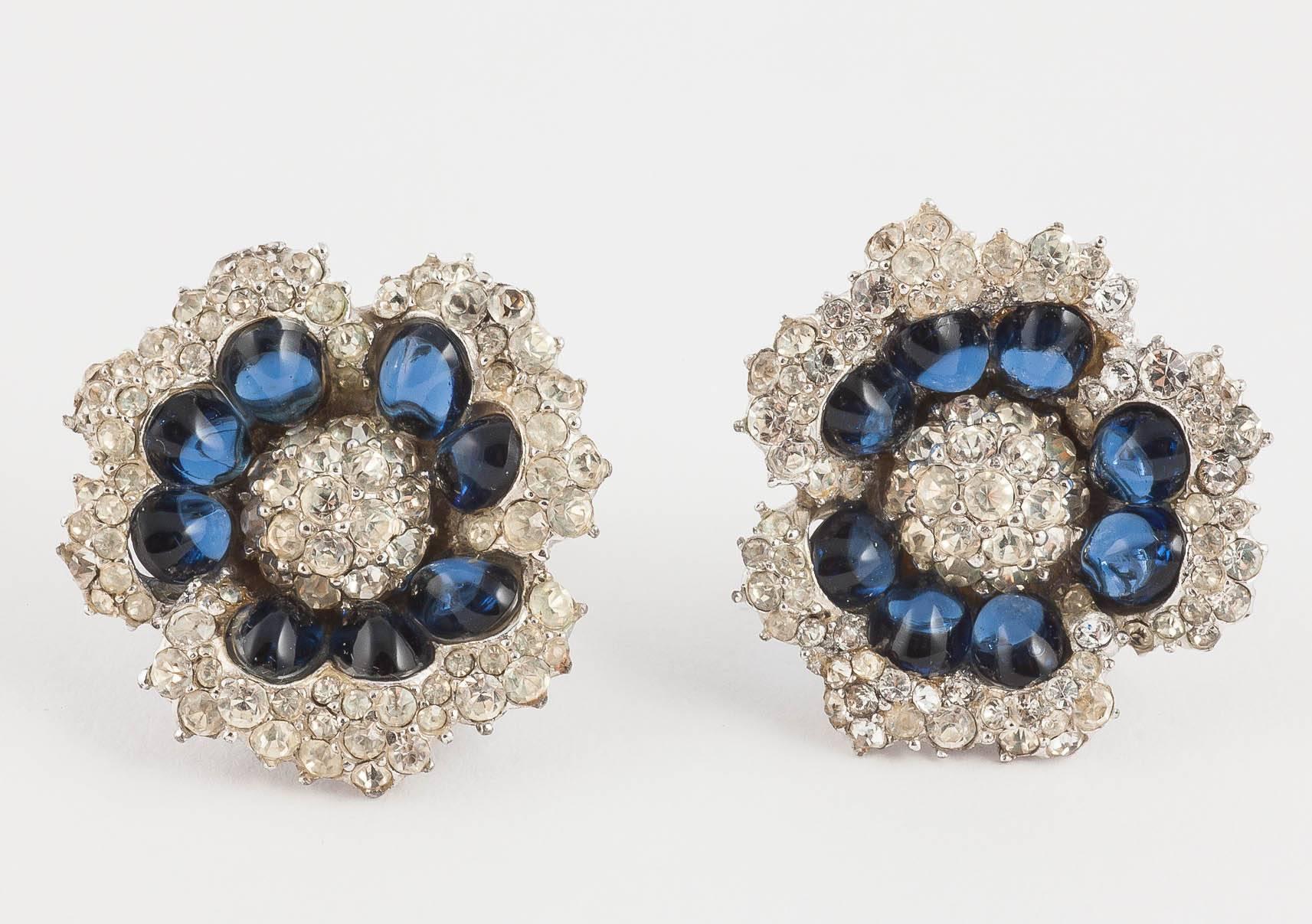 Wonderfully chic and sumptuous 'flower' brooch with matching earrings, by Marcel Boucher from the 1960s, perhaps one of his most elegant designs. Made from sapphire paste cabuchons, clear pastes and pearl, this design recalls the marvellous designs