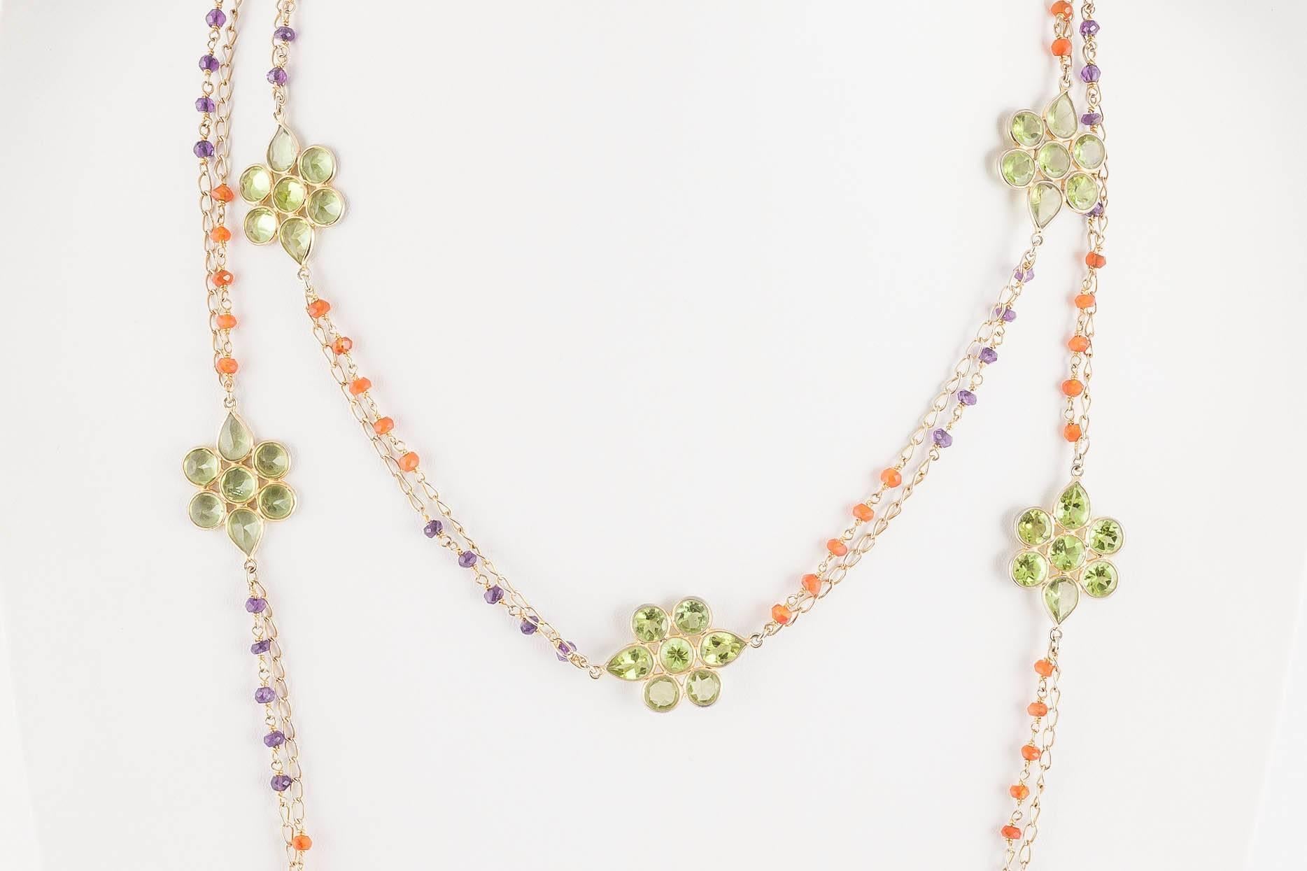 This is a beautifully made silver gilt necklace with lovely hand set peridot flowers interspersed with carnelian and amethyst beads. It is a really light and joyous addition to a Spring summer wardrobe. Probably made in the 1990s in Italy. 
