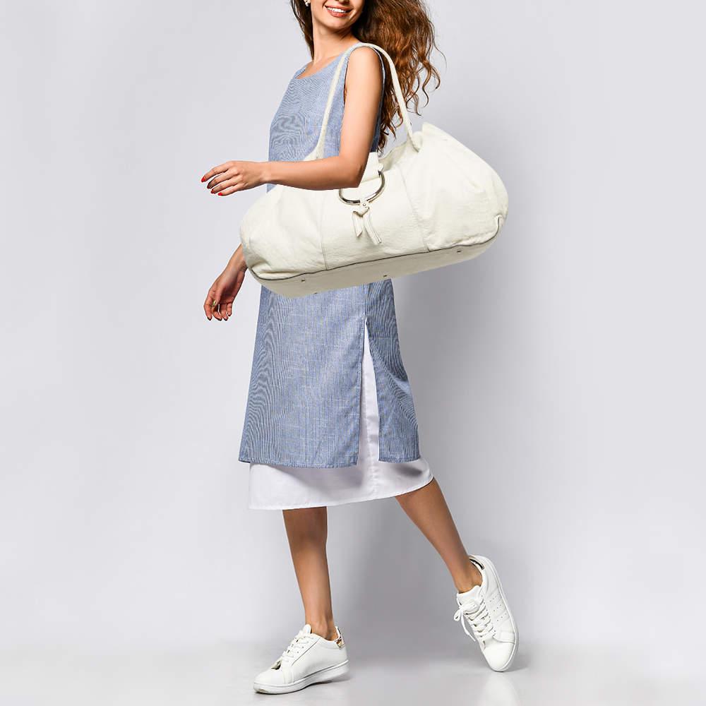 Designer bags are ideal companions for ample occasions Here we have a fashion meets functionality piece crafted with precision. It has been equipped with a well sized interior that can easily fit your small essentials.