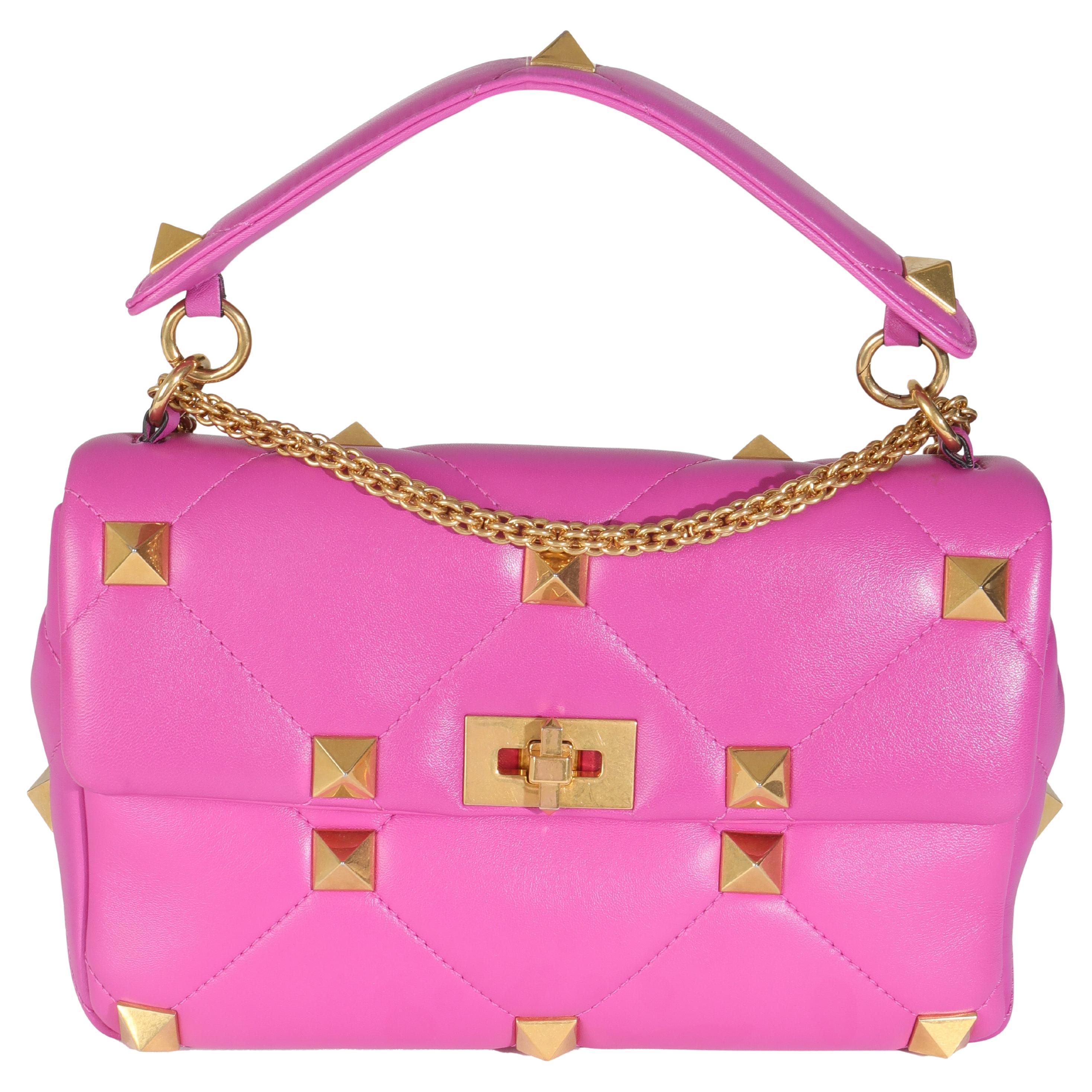 Bolso romano mediano con tachuelas Valentino en napa rosa en venta