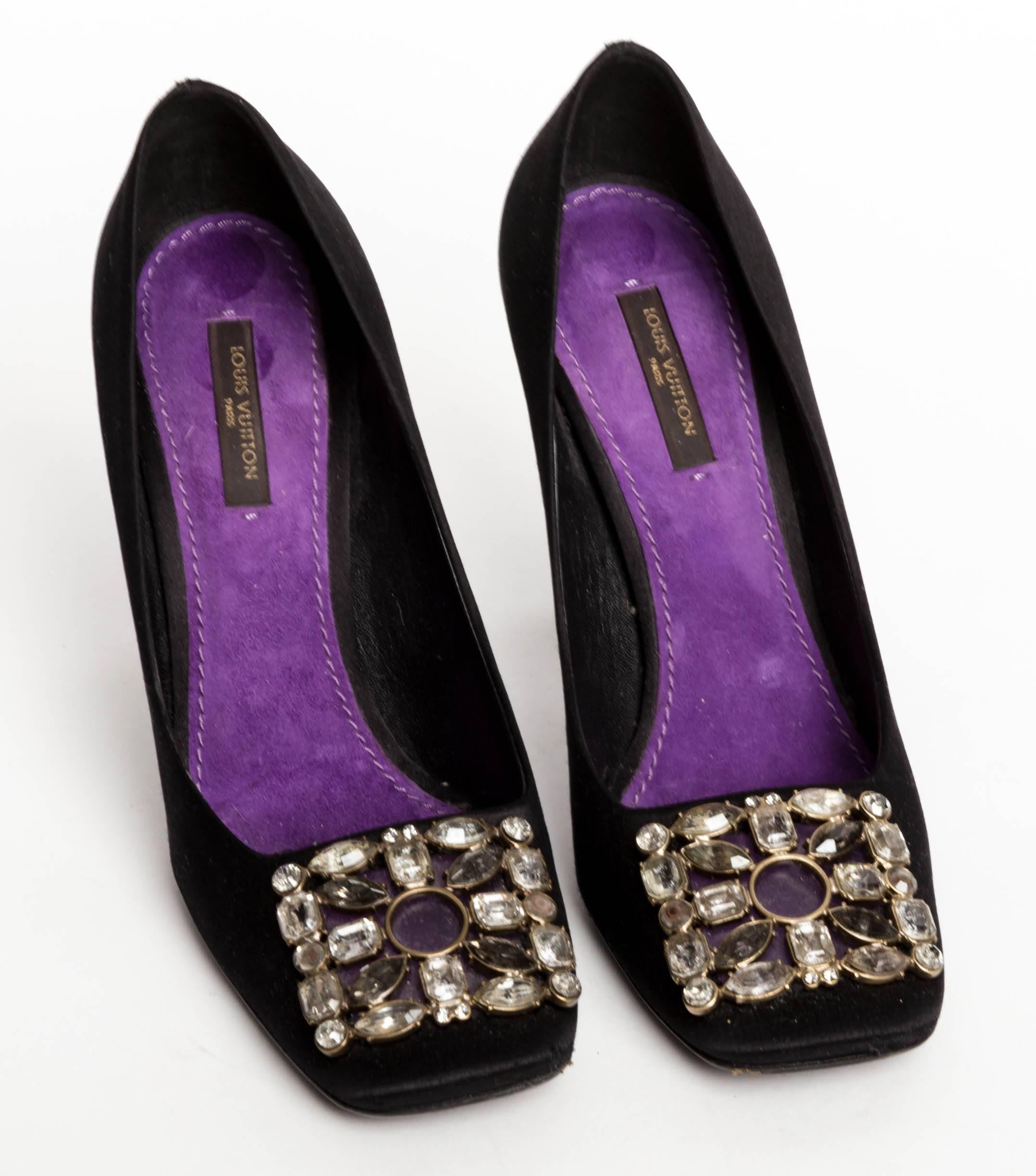 Stunning Louis Vuitton Black Silk Pumps with Jeweled Buckles - 37 1/2
Buckles consist of marquise, square and round cut crystals.
Lined in purple suede, these shoes are a work of art.