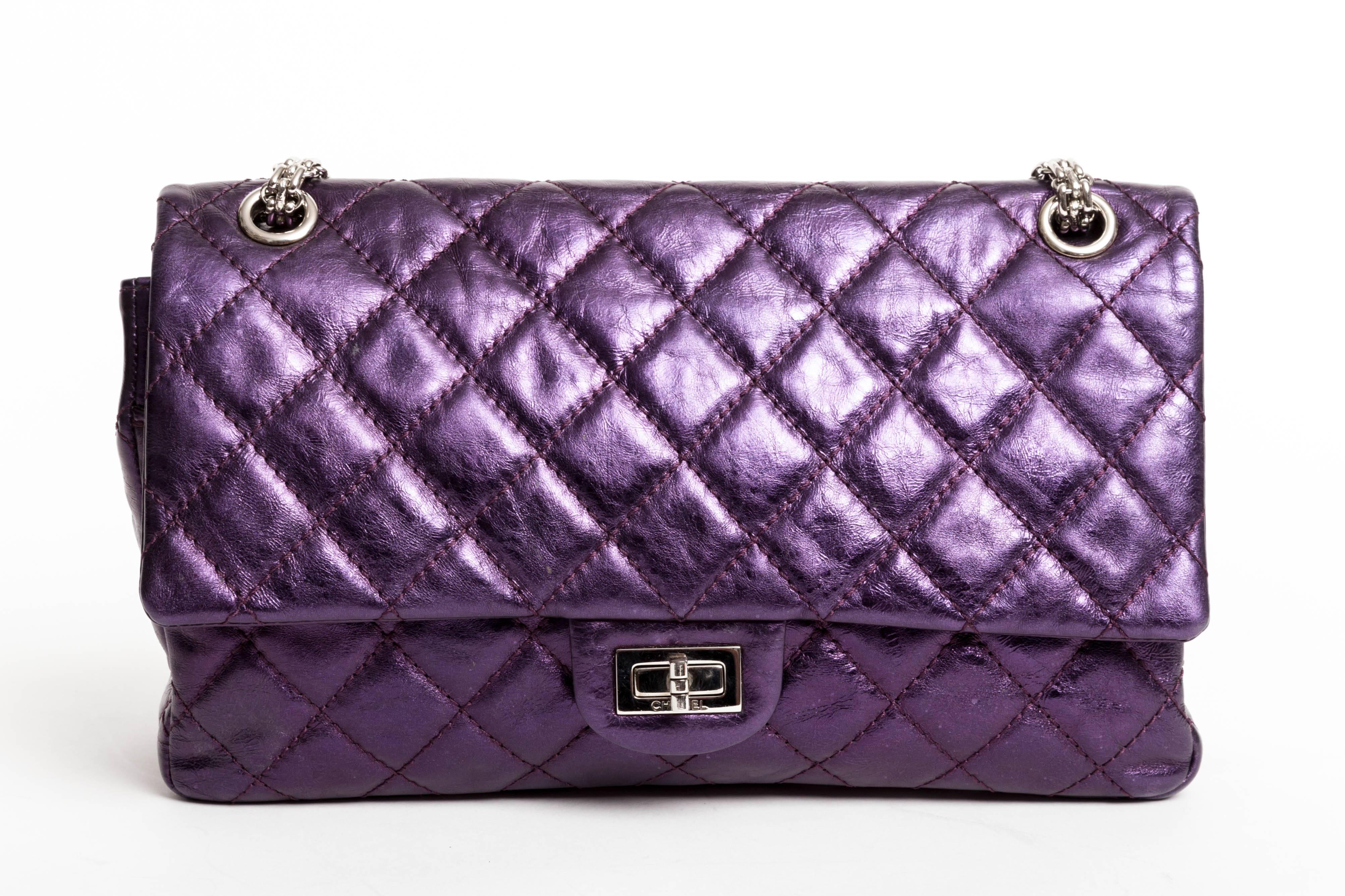This Chanel Purple Metallic Reissue is in excellent condition.
Authenticity card No 12160656 denotes the years 2008 - 2009
Dust Bag is included.
Features one half moon back pocket as well as a zip pocket to the top flap of the bag. A large pocket