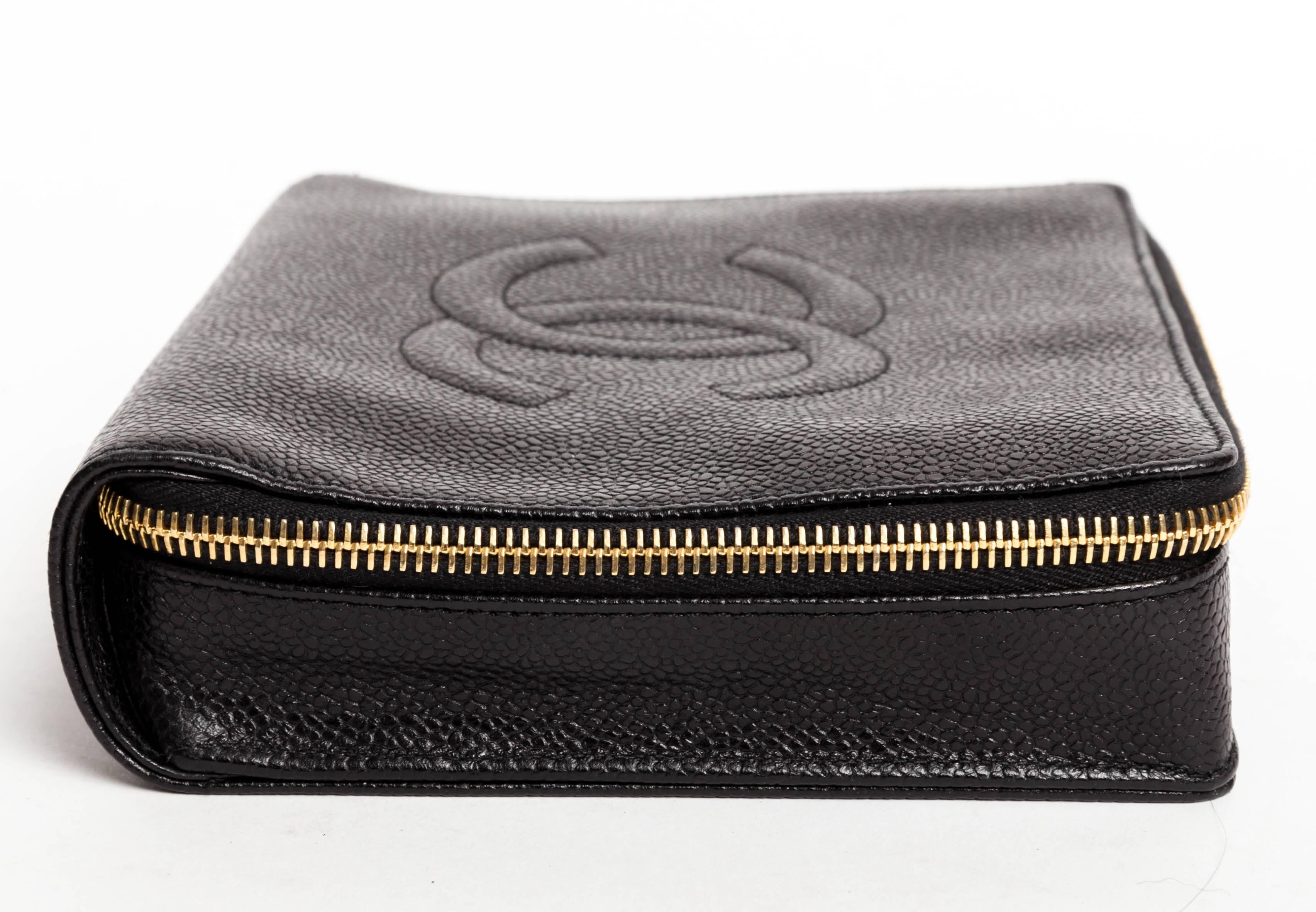 Vintage 1997 - 1999 Chanel Black Caviar Jewelry Case with Gold Hardware. 
This wonderful Chanel case is lined in velvet with one removable velvet pad, two velvet pockets and one zip compartment. 
Authenticity No 5005915
This very chic case could