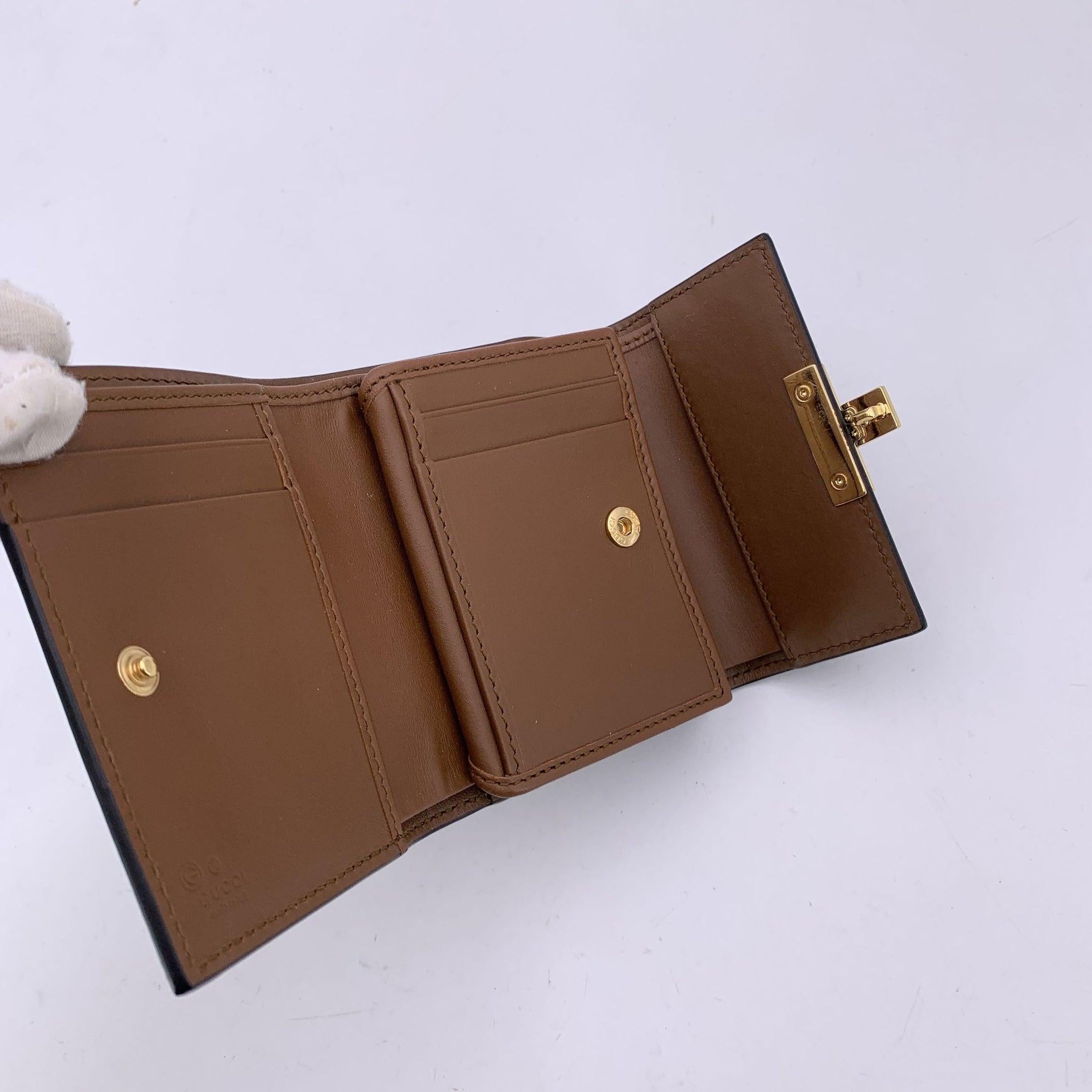 Portefeuille à cadenas en toile et cuir avec monogramme GG de Gucci Excellent état à Rome, Rome