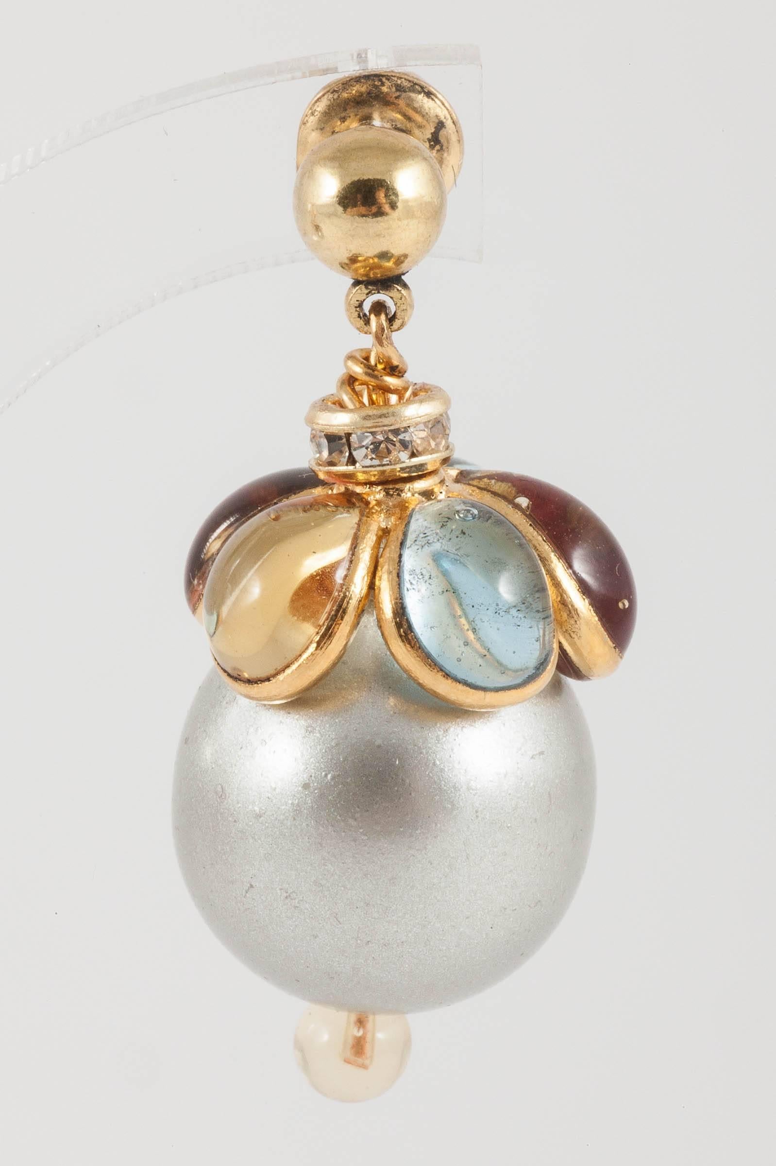 Delicate and delightful drop gilt earrings, with a grey pearl, capped in citrine and aquamarine poured glass petals, and a citrine poured glass bead underneath the pearl to highlight and finish off.Light and easy to wear. From the WW collection, a