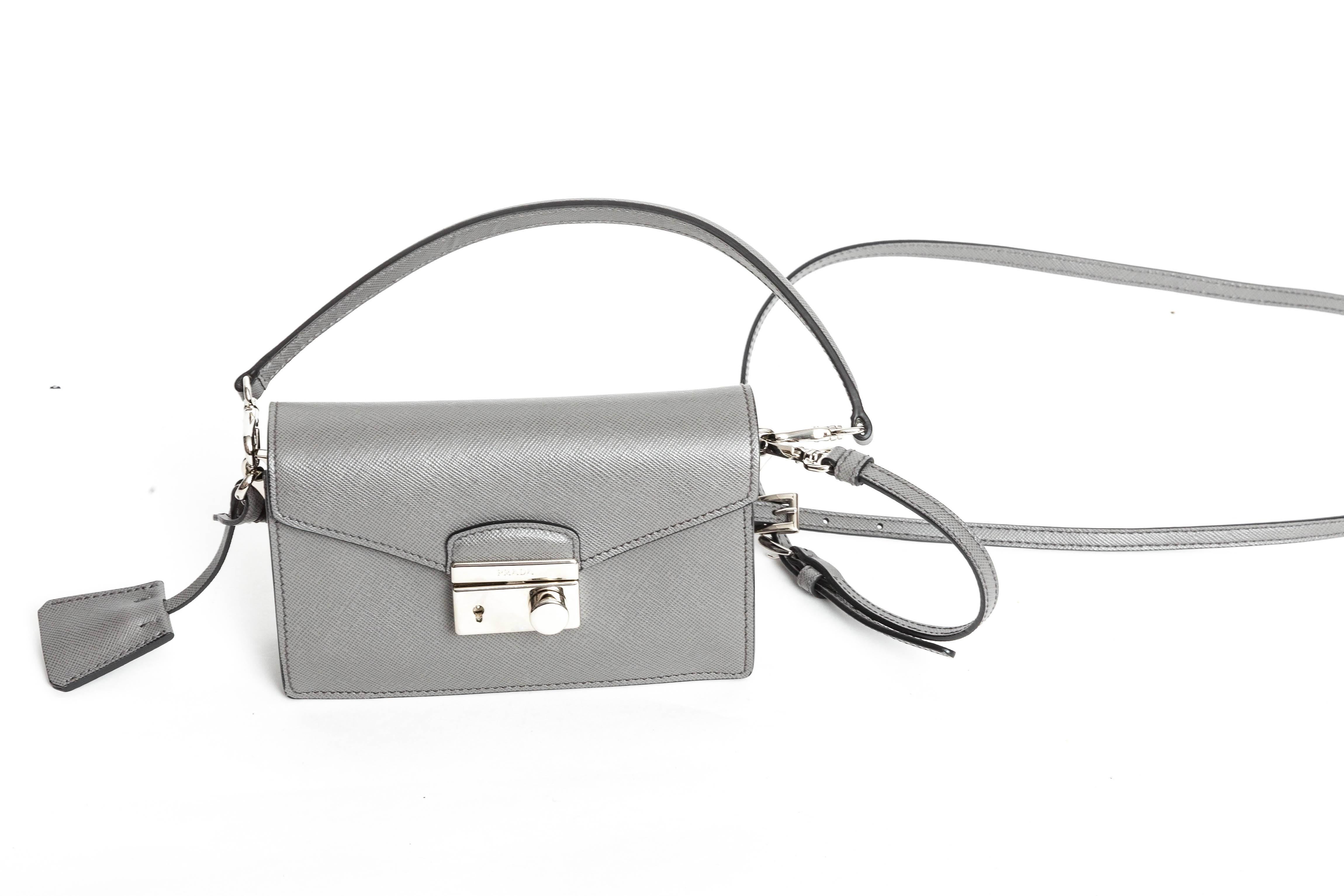Wonderful Prada Gray Saffiano Crossbody Mini with Top Handle and Detachable Shoulder Strap
Condition is excellent.
Dust bag is included.

