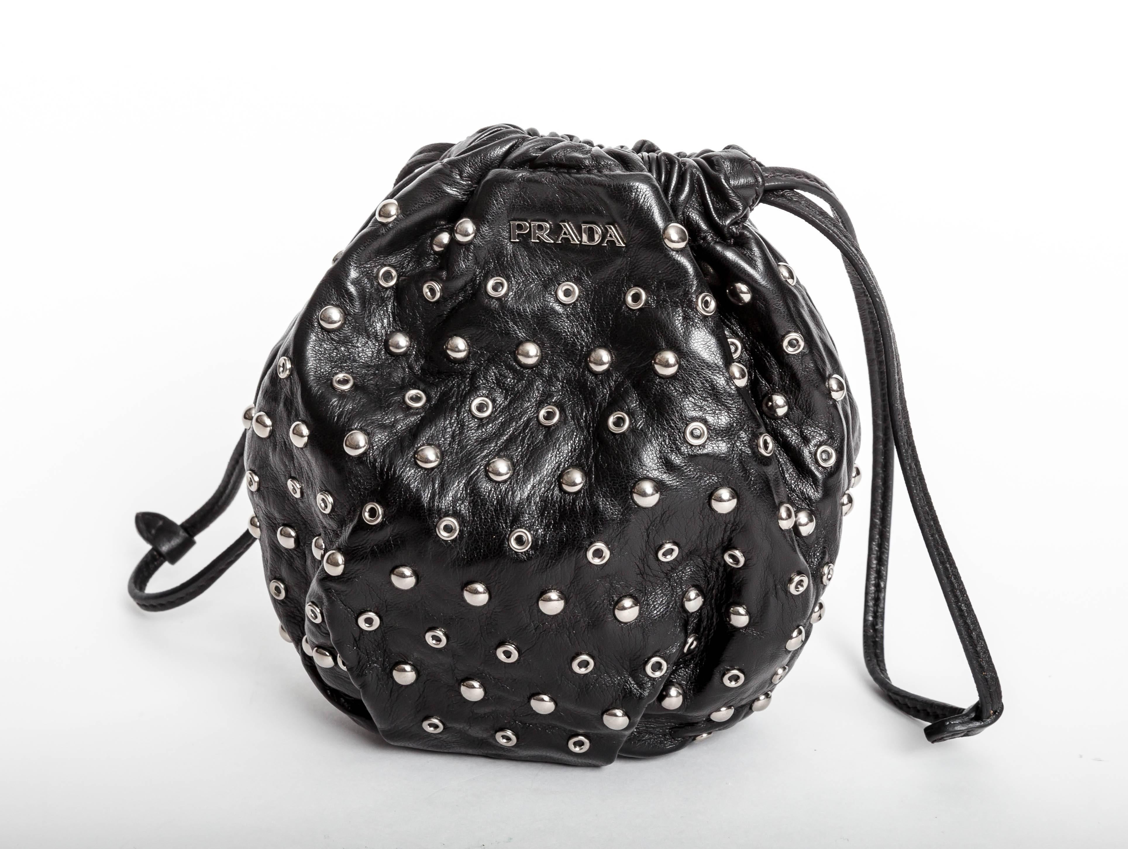 Adorable Drawstring Prada Nappa Leather Bag with Studs and Grommets.
May be carried as a wristlet 
Condition is immaculate.