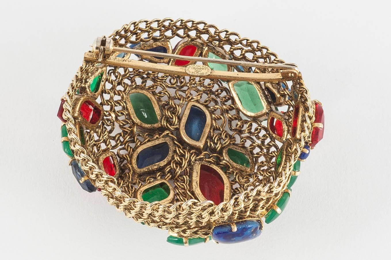  Multi coloured jewelled brooch signed and dated 