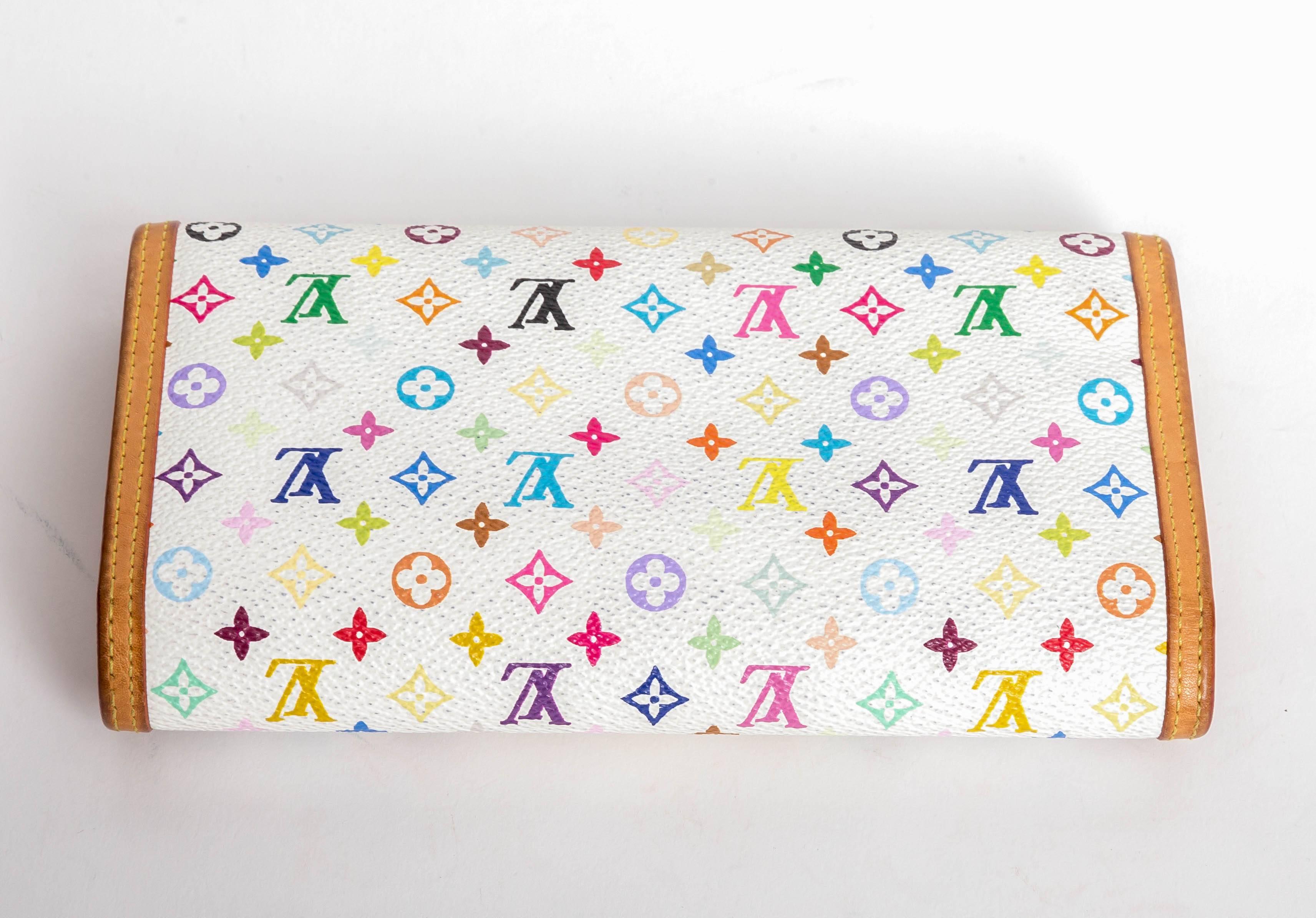 This Louis Vuitton White Monogram Multicolore Porte-Tresor International Wallet is the most elegant way to organize your essentials like your bills, checkbook, credit cards and plenty of coins. This delightful piece will always be a timeless