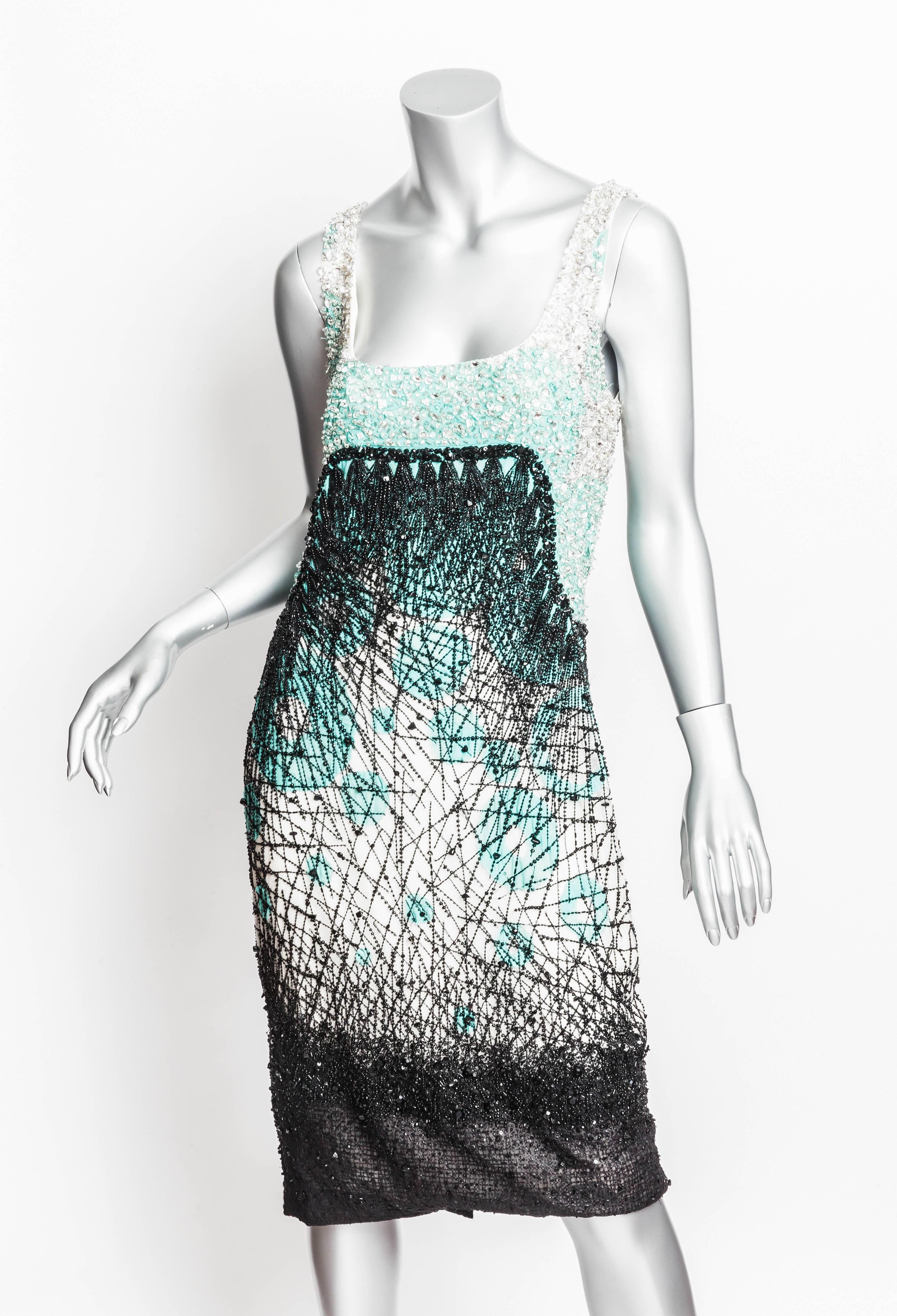 Breathtaking Carolina Herrera Silk Beaded Cocktail Dress.
In shades of sea foam green, cream and black, this heavily beaded dress is embellished with faceted crystals and sequins.
