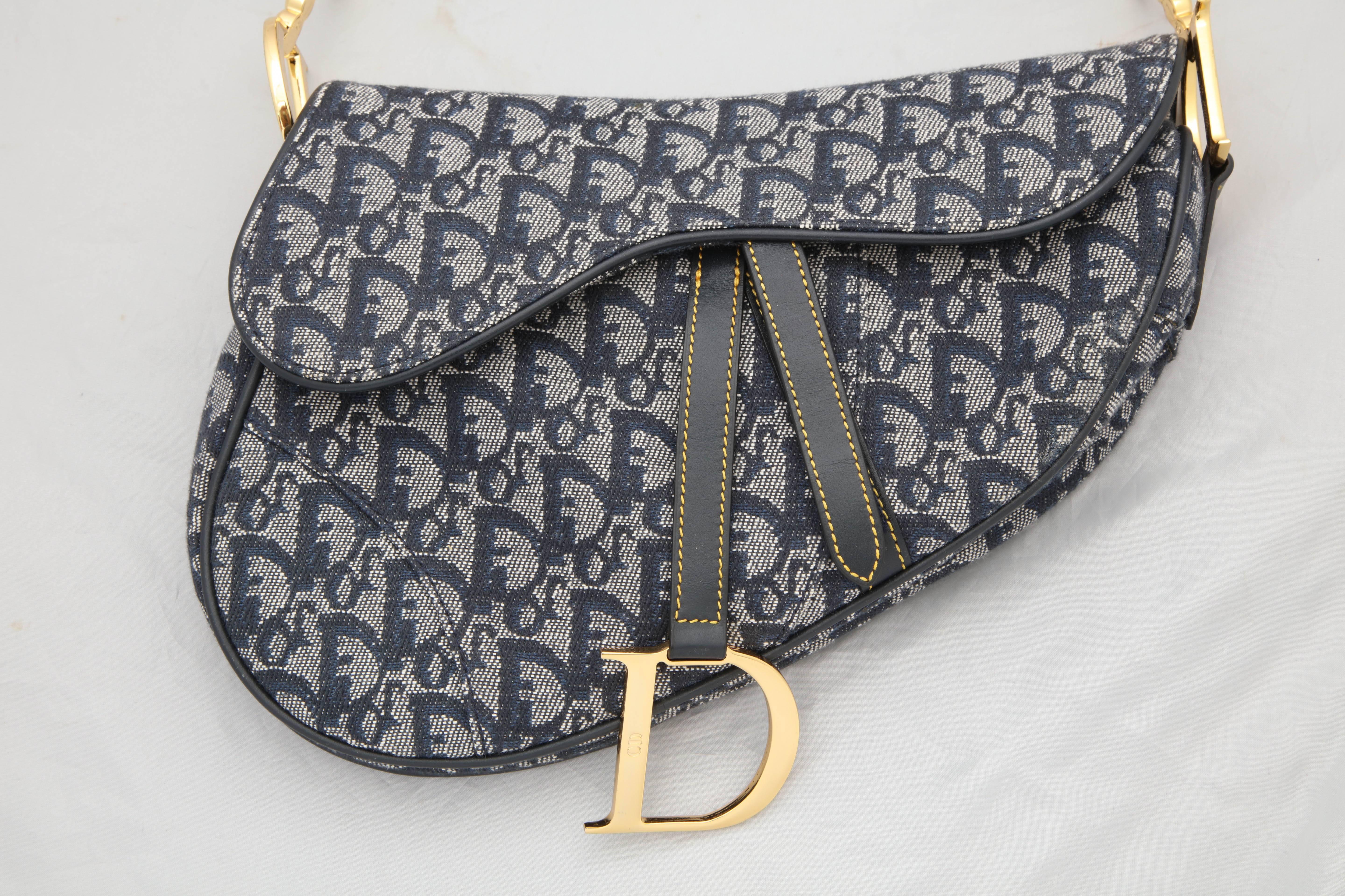 Christian Dior by John Galliano iconic saddle bag with Dior logos. 