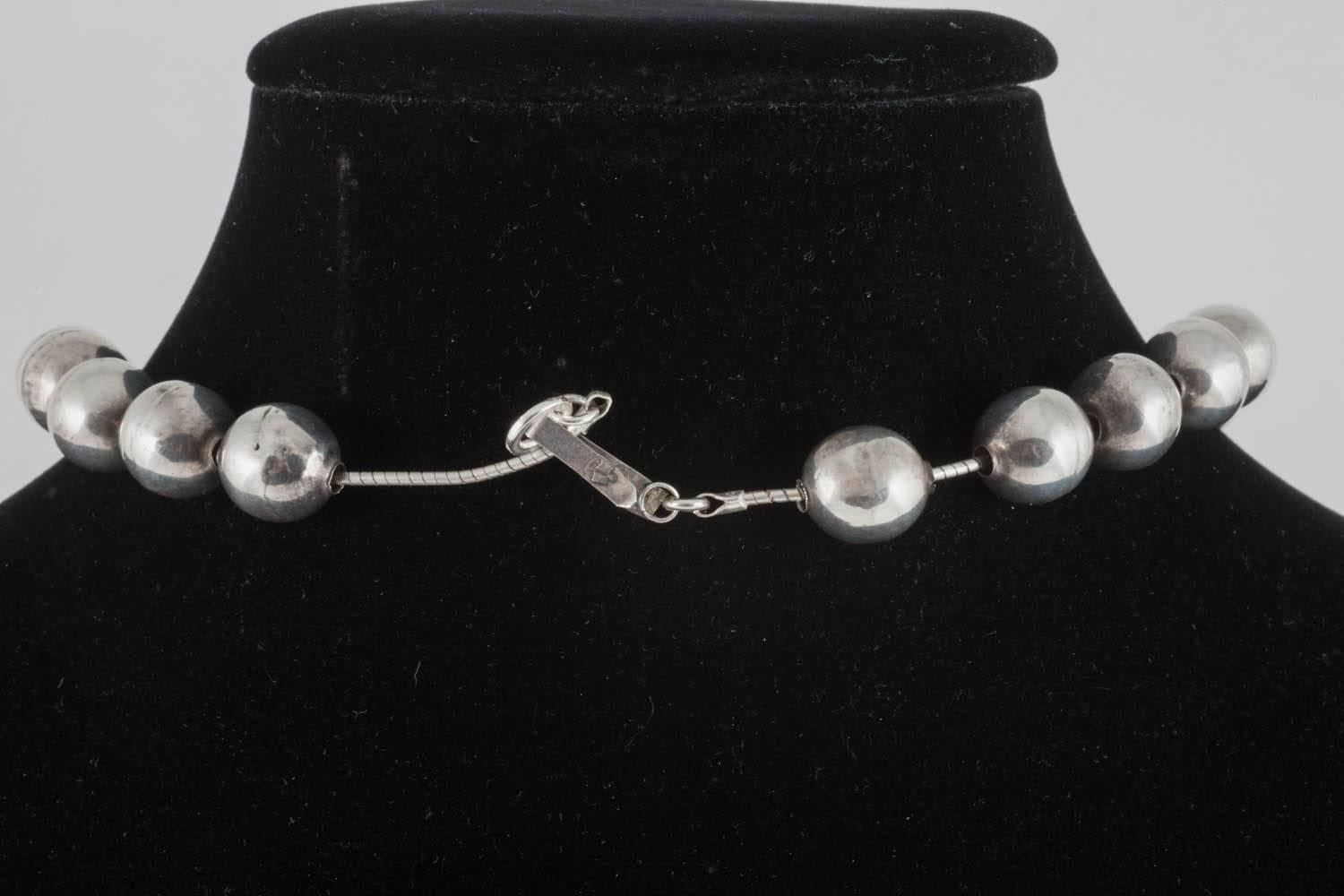 Sterling silver hand wrought 'clam shell' and hollow ball necklace, Mexican.. 1