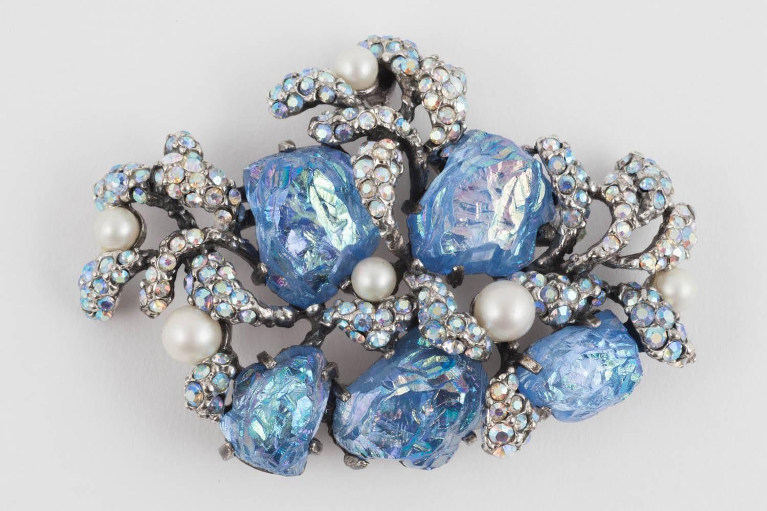Schiaparelli uses this highly surrealistic subject matter, seaweed, to create a ravishing brooch and earrings, featuring her celebrated 'lava' stones, in blue, the 'seaweed' encrusted in aurora borealis pastes, so fashionable at the time of