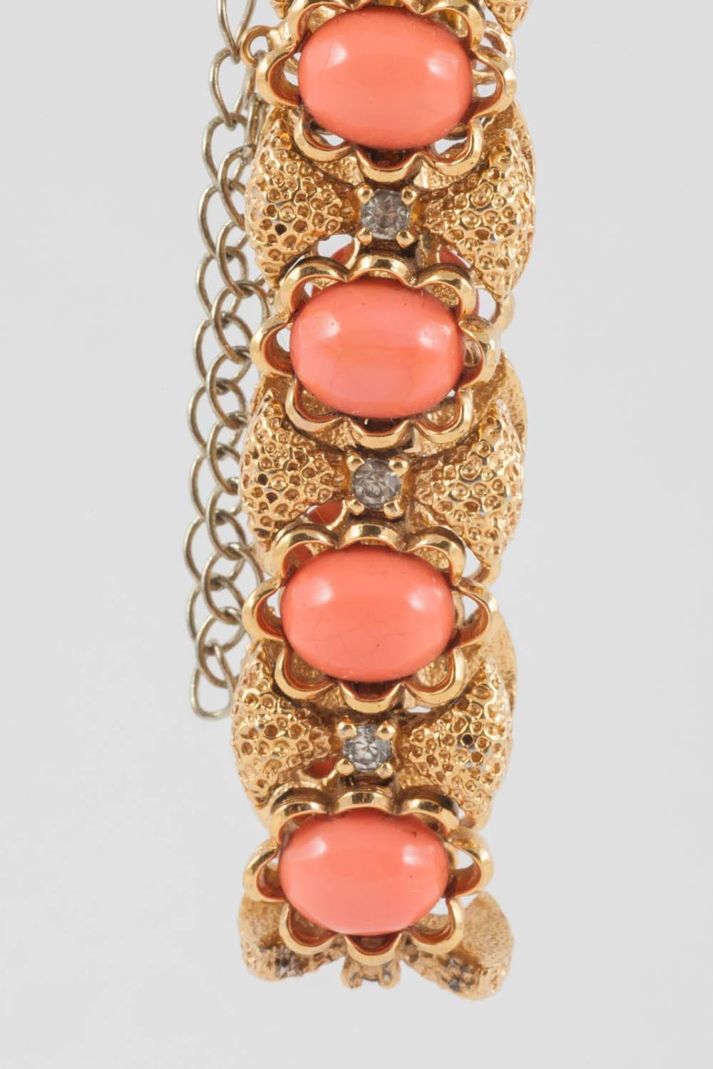 As so often with Panetta, this bracelet plays on the theme of 'real' jewellery but with a costume sensibility.
Benedetto Panetta was trained as a goldsmith and his pieces are so well made that they are a joy to wear. The faux coral are Lucite, and