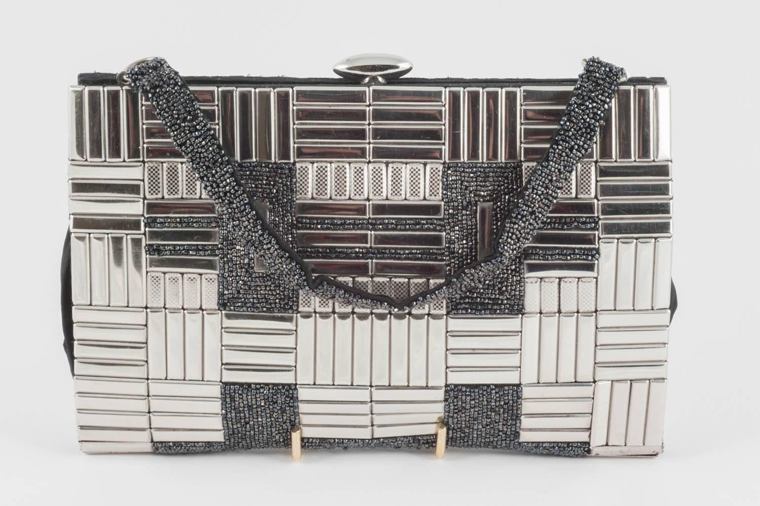 Highly unusual and striking, this handbag/clutch was probably made in Germany, most definitely in the1930s. Chrome 'panels' are attached, on both sides, to a fabric bag - some vertical, some horizontal, some shiney, some textured -  with beading