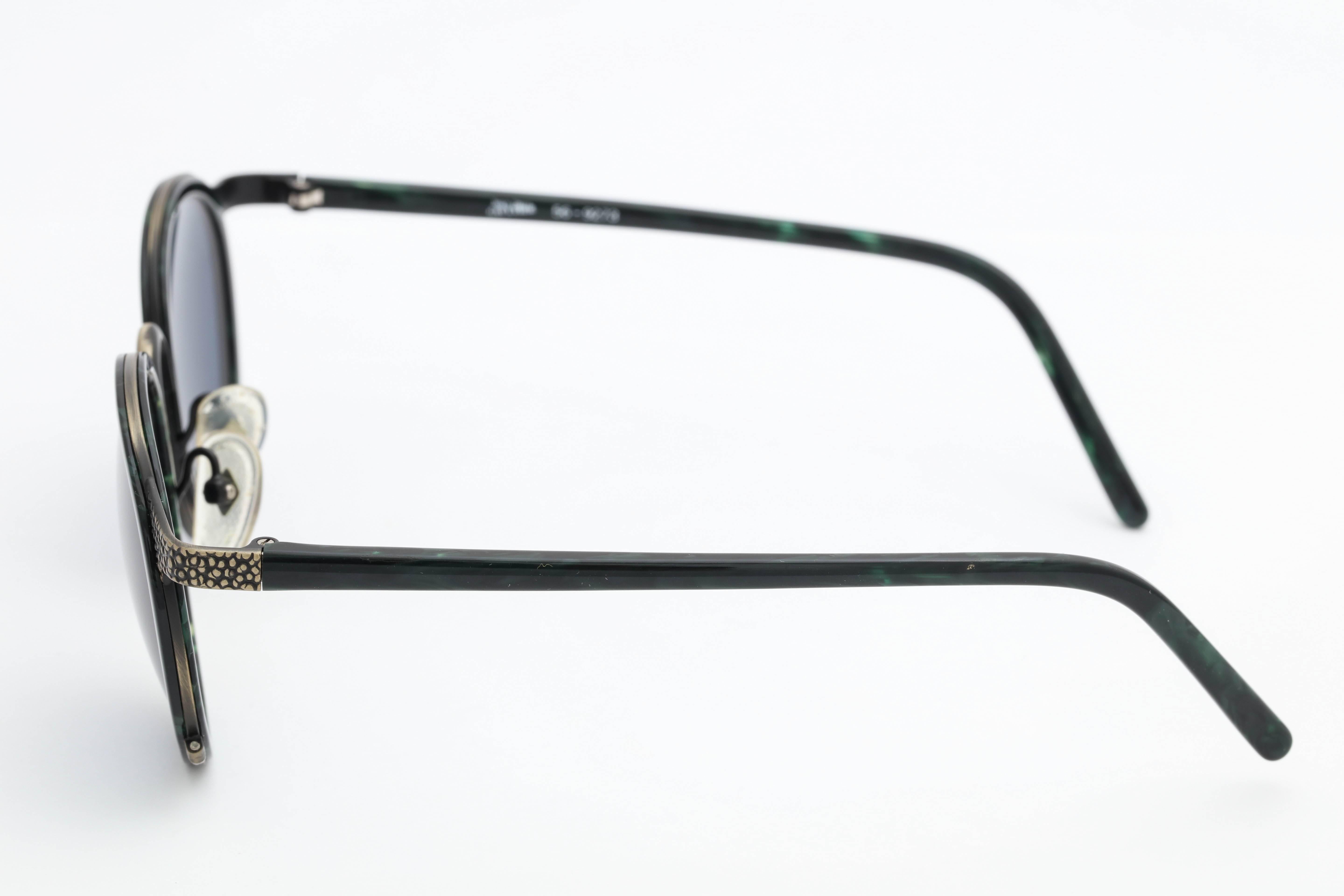 Green/Black Vintage Jean Paul Gaultier Sunglasses

Frame Width: 150mm 
Lens Width: 51mm 
Frame Height: 54mm 
Arm Length: 124mm