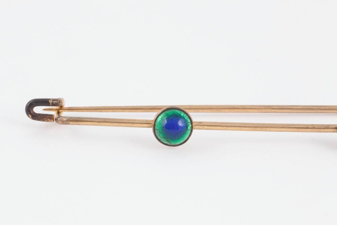 This is the second pin listed of this type. This pin has a gloriously rich gilding and 3 enamel peacock 'stones' probably used to pin a shawl together - it would also make the ultimate kilt pin.  