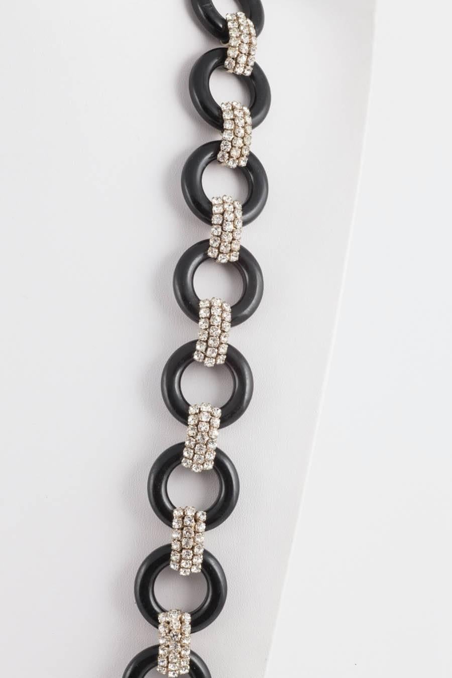 A long continuous row of plastic circles and paste connecting pieces create this very smart necklace, made in the Art Deco style, from the 1970s, a period when style and designers looked back to the 1930s for inspiration and in admiration. Of