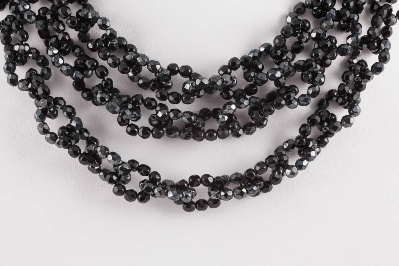 Made from half crystal faceted beads , one loop is of high gloss beads, the next, less glossy, with more of a matt texture, alternating likewise through each row, throughout the whole necklace. This gives the impression of a very subtle colour